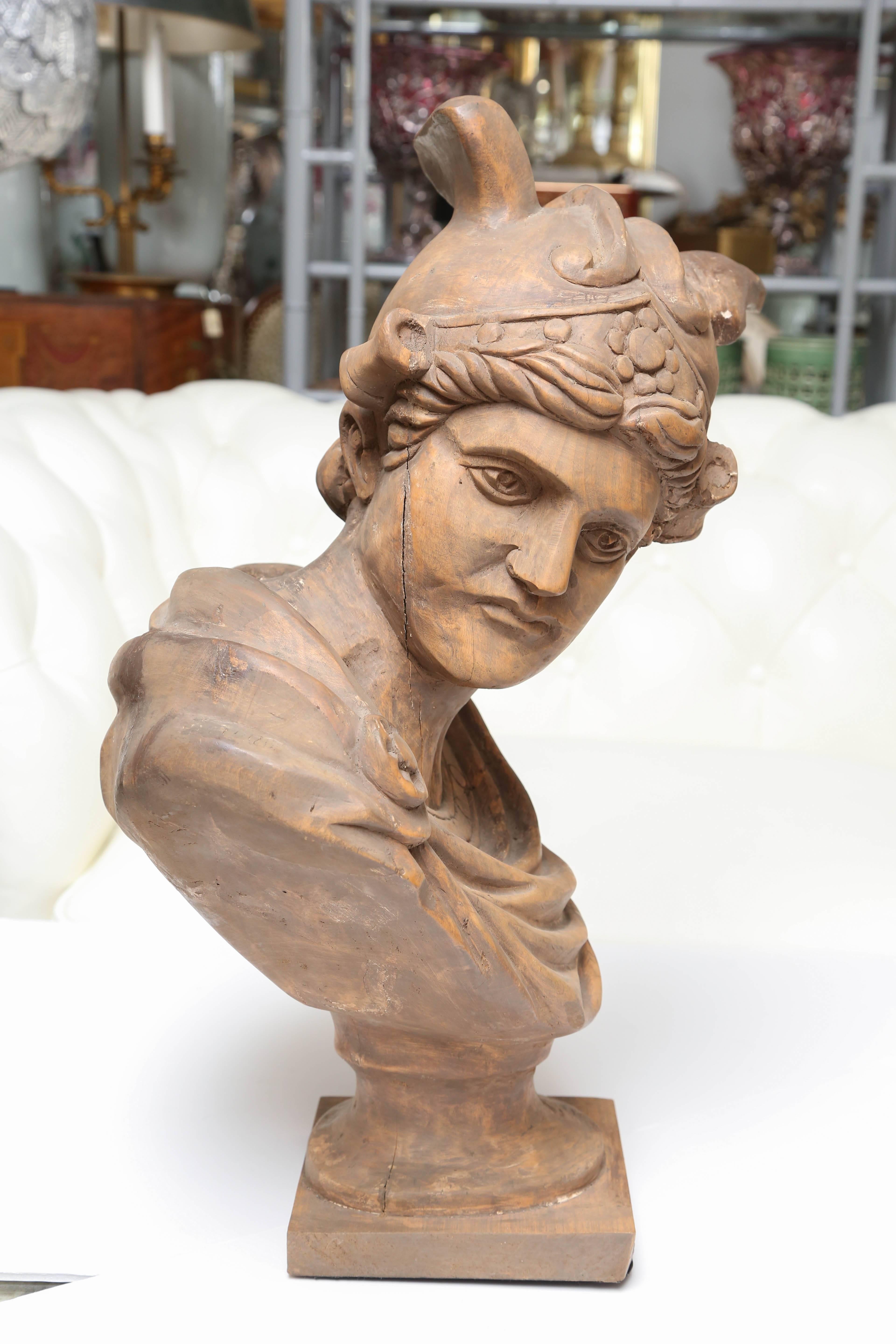 Nearly lifesize with an expressive face.
Carved from a single piece of wood.