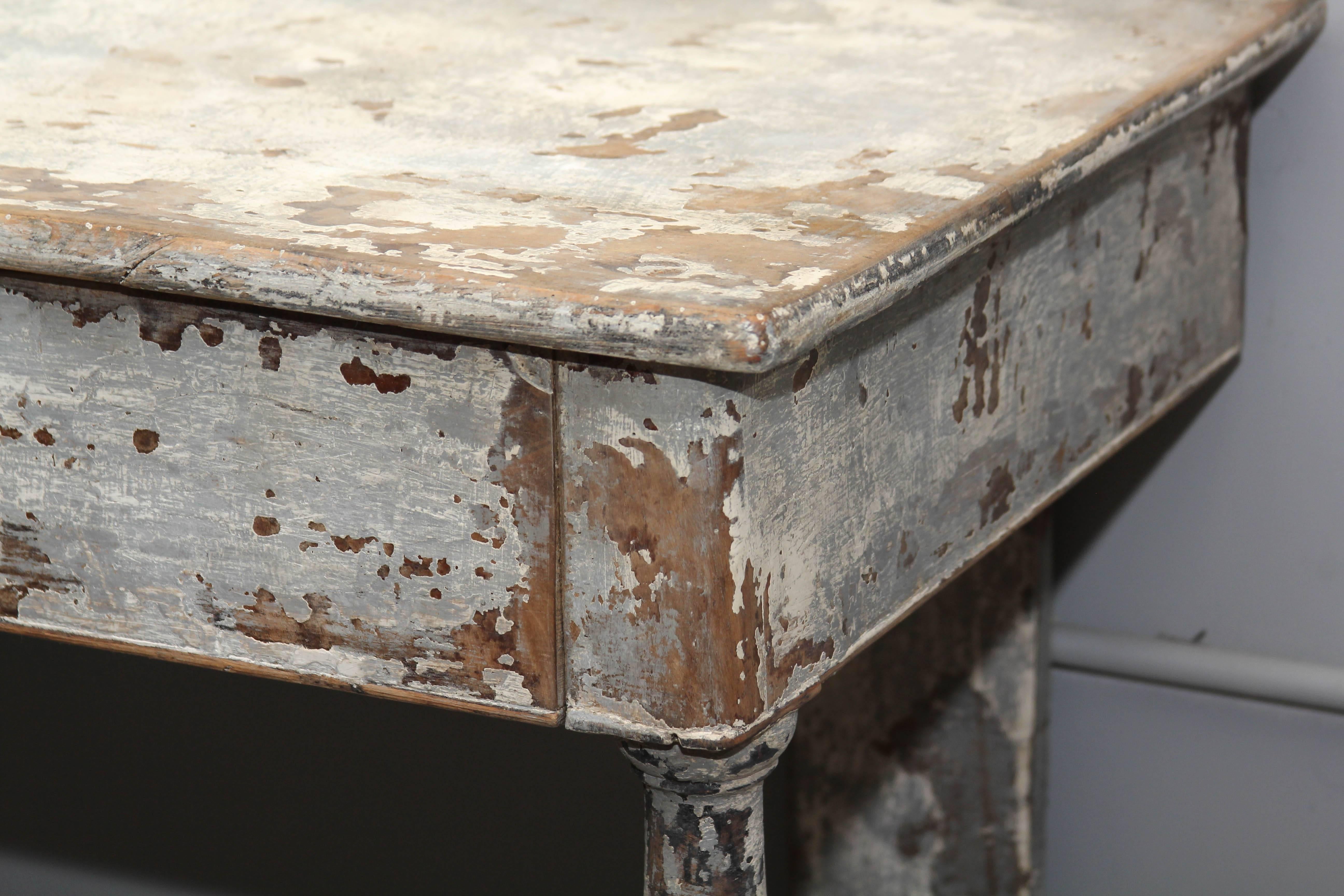 French country console table in a perfectly distressed-paint finish in a highly desirable size; several features make this single drawer piece special: beautiful lathe-turned legs, dove-tailed joinery, and a scalloped bottom plank. It's all here.