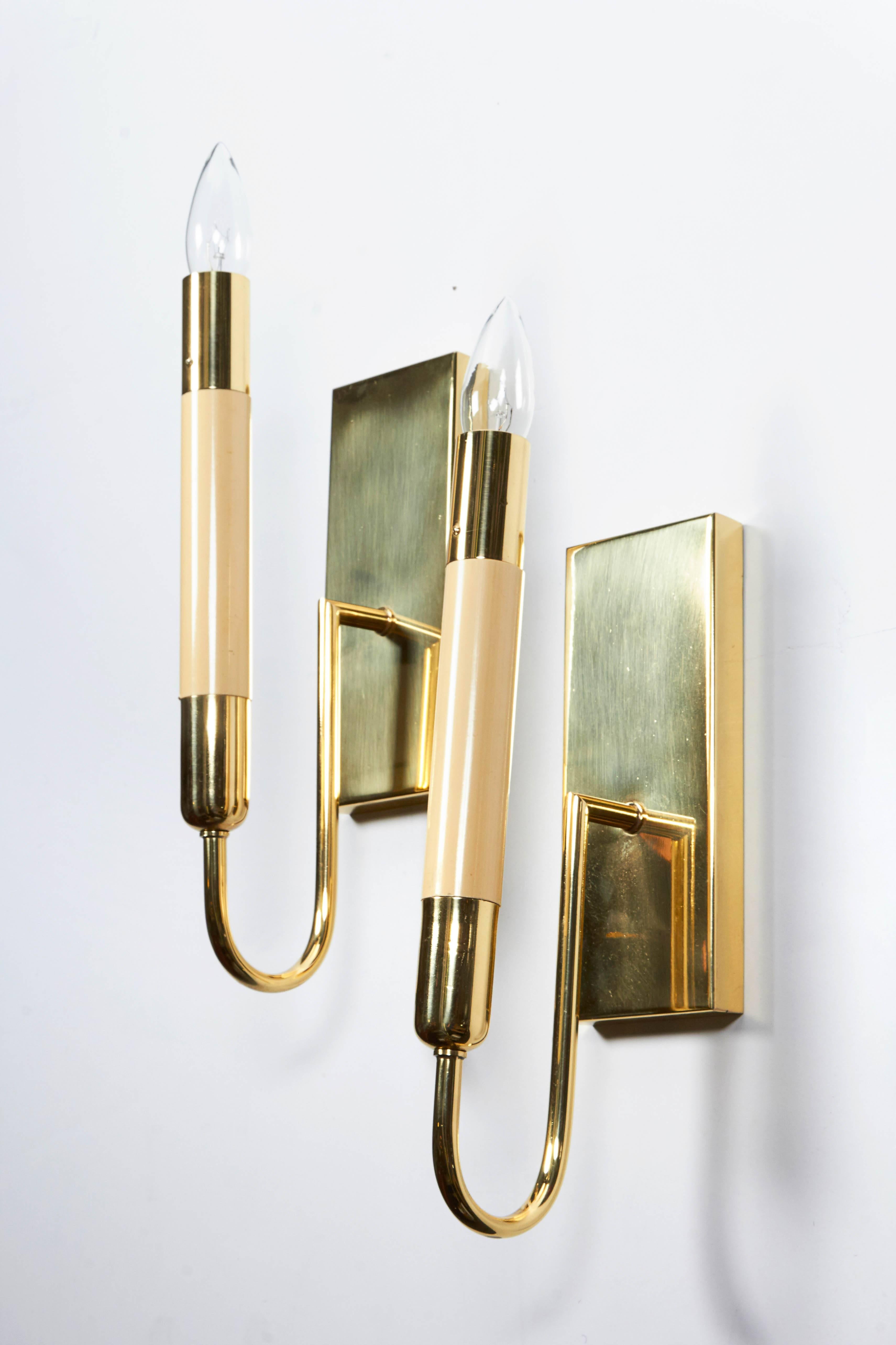 A pair of 1950 Italian ivory color resin and brass modern sconces.
Candelabra socket.