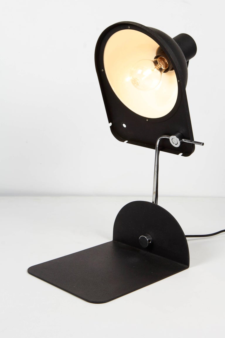 1970 black satin enamel and chrome desk lamp or wall shelf lamp by Italian lighting company Luci, printed 