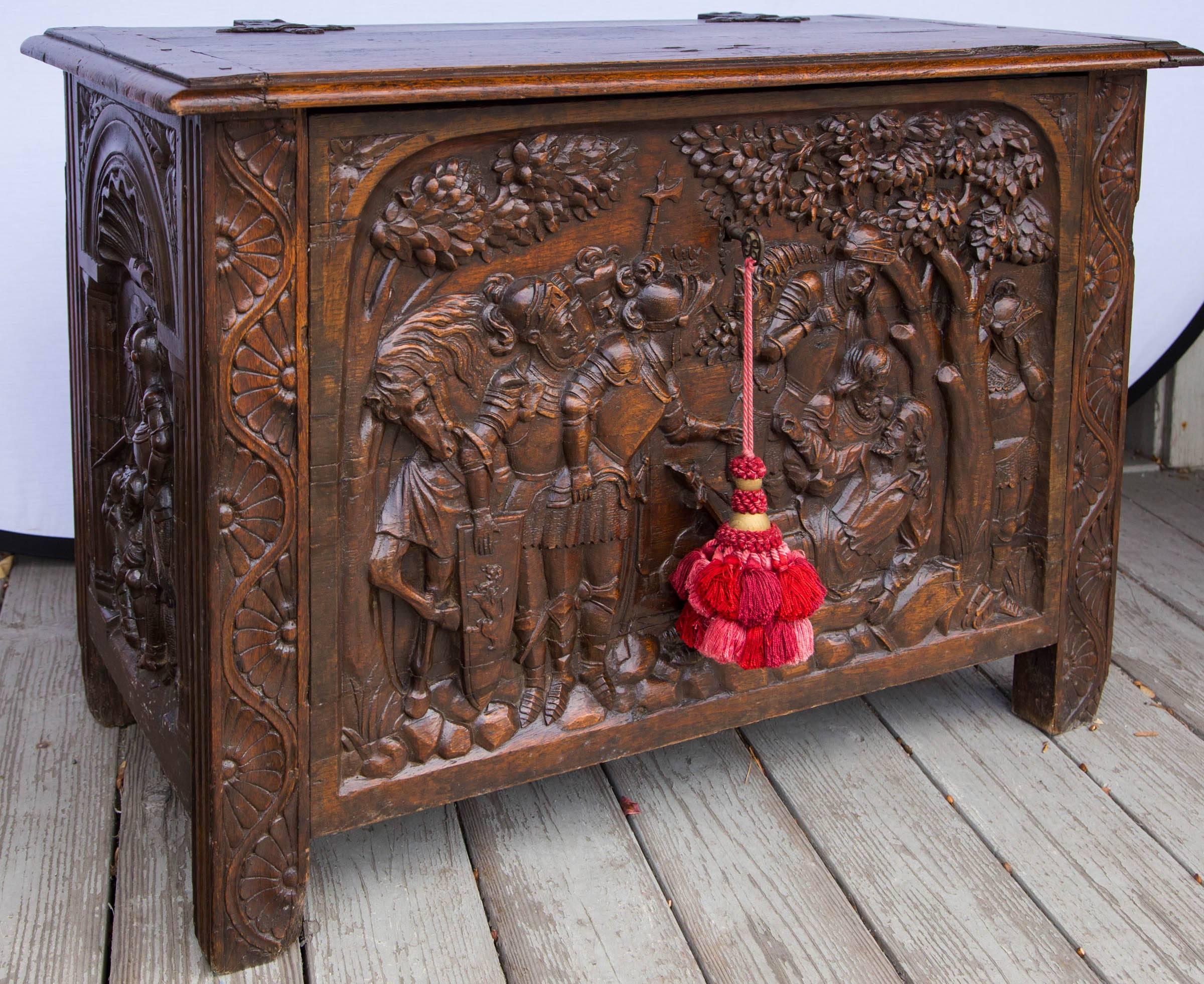 This amazing coffer is hand-carved in deep relief. The iron hardware is all original, as is the lock. Inside the lid is a paper, handwritten with the following inscription:

