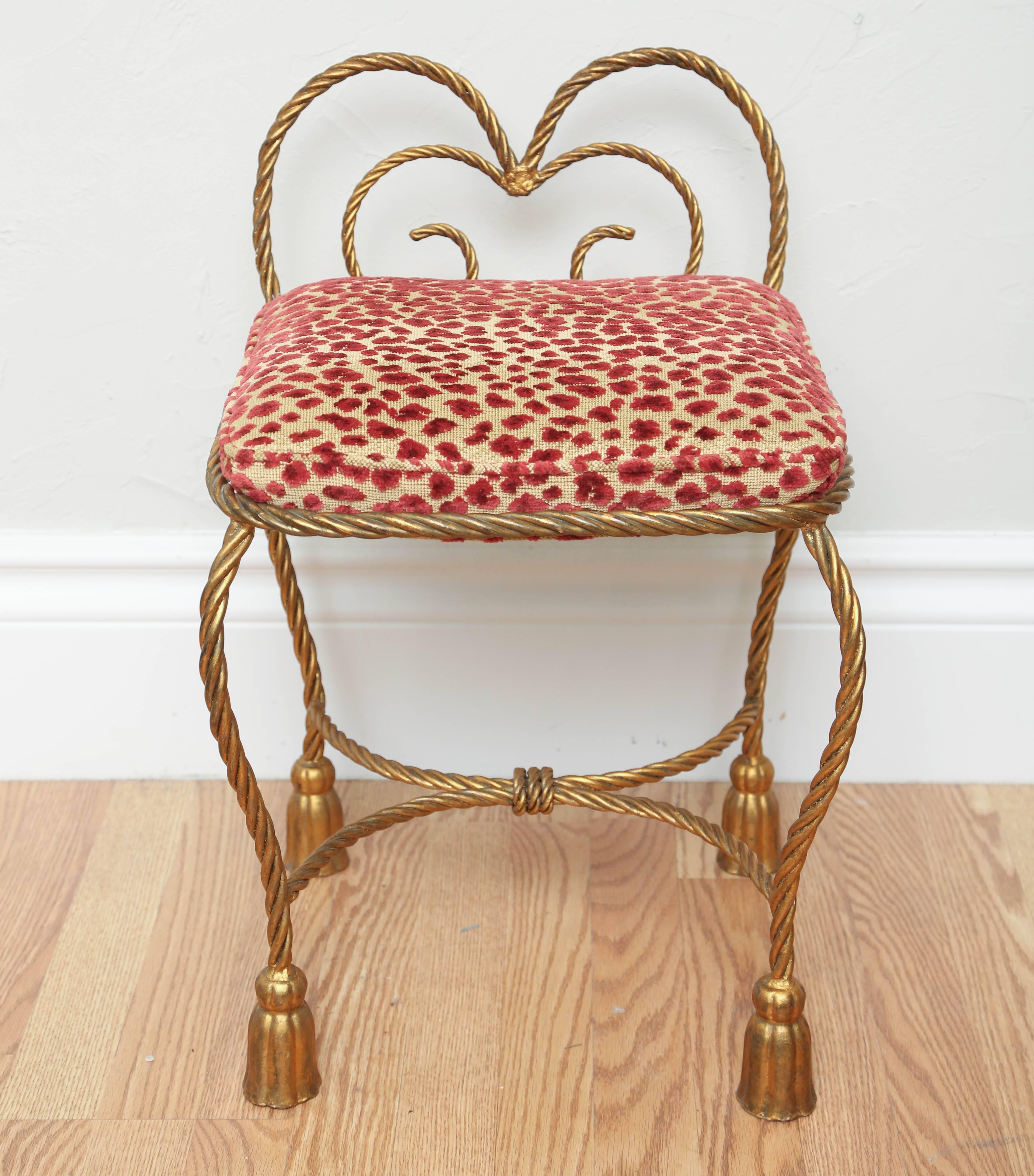 Hollywood Regency Italian gilded metal rope and tassel vanity bench with new red/gold leopard velvet fabric.