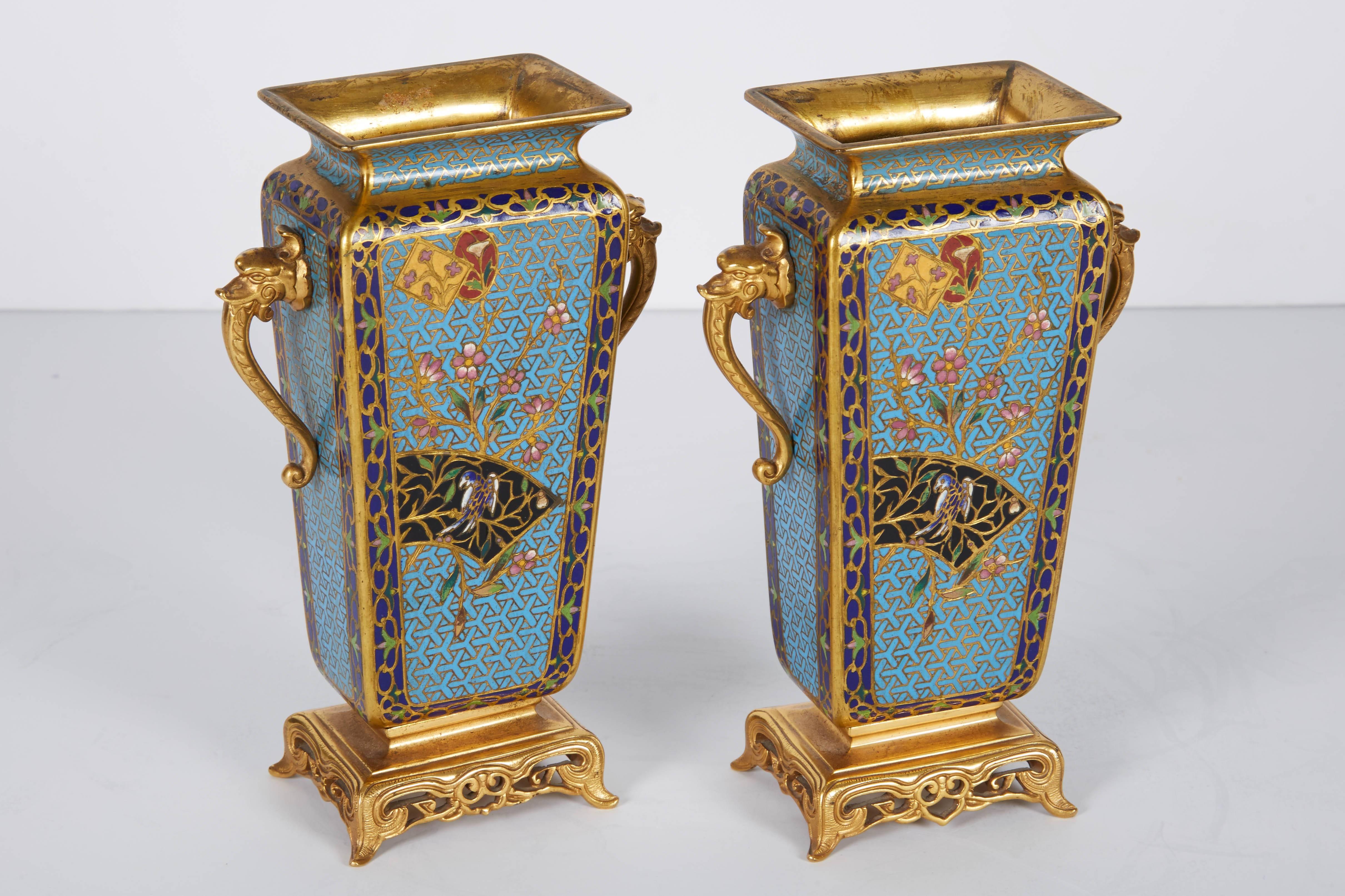 A magnificent pair of French ormolu bronze and champleve´ cloisonne´ enamel vases. 

19th century.

7.5