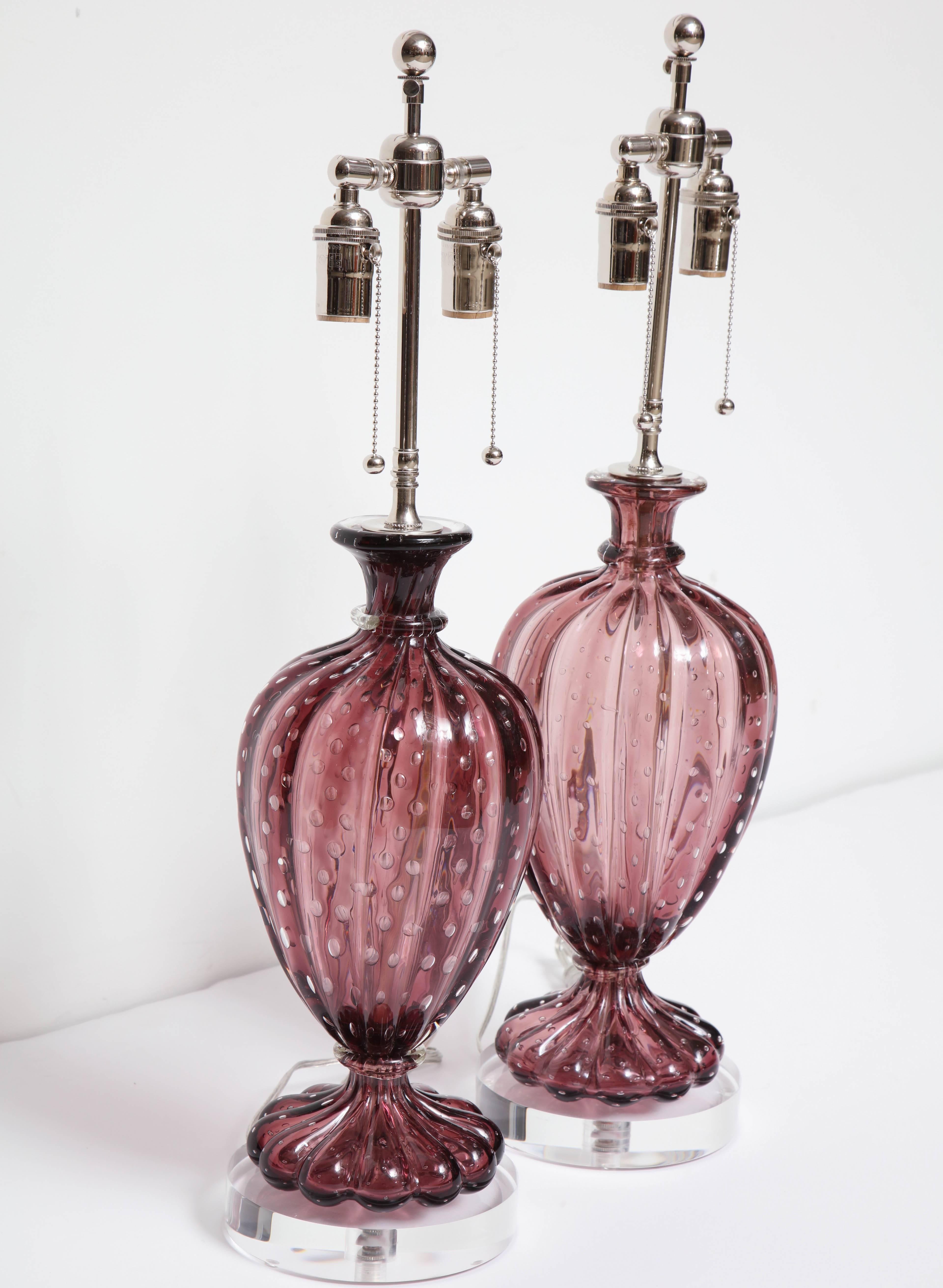 Beautiful large pair of Amethyst Barovier Lamps.
The handblown Amethyst color glass has controlled bubbles and are mounted on thick Lucite bases.
The lamps have been newly rewired for the US with polished nickel double clusters that take standard