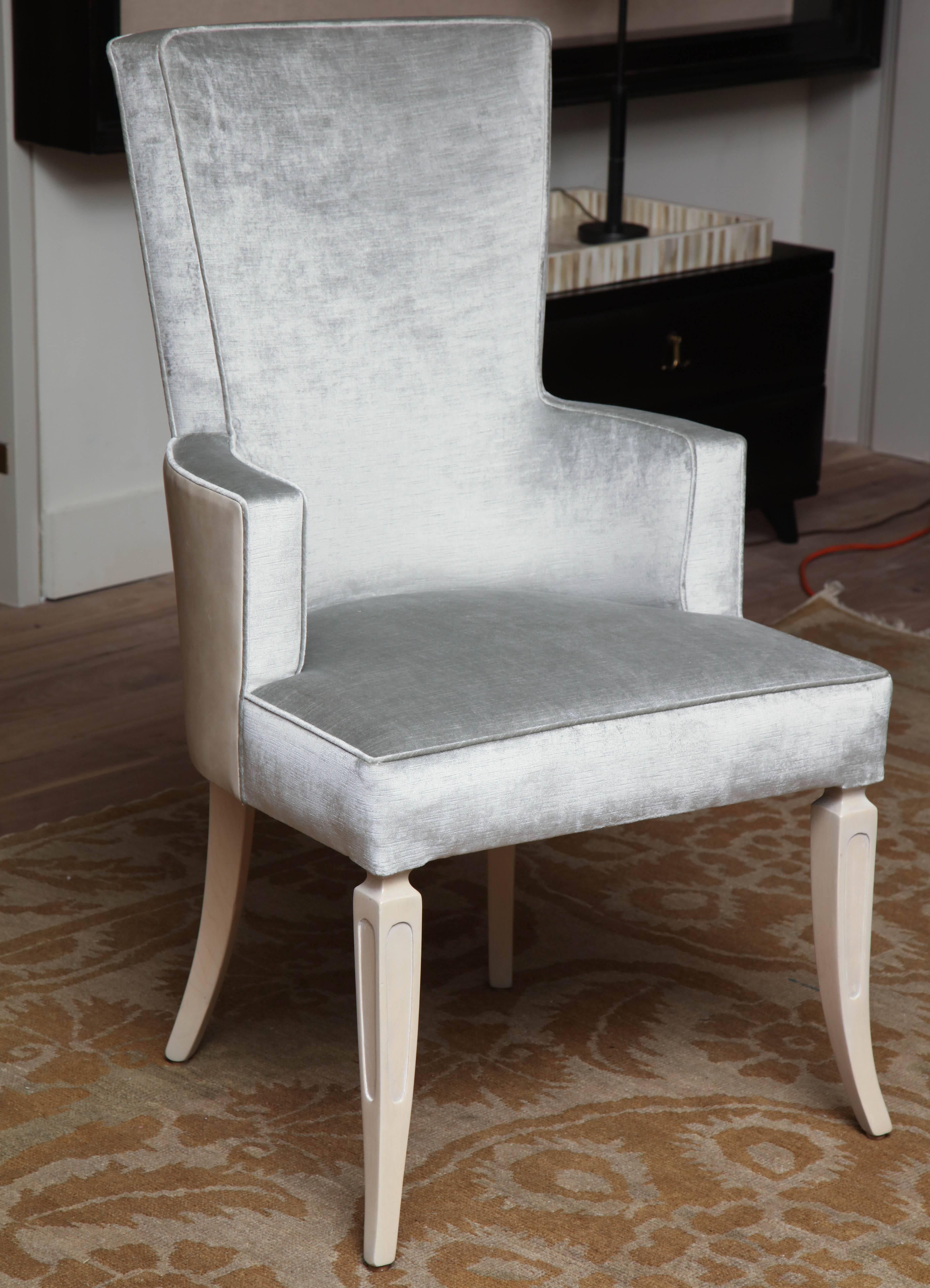 Pair of wingback dining chairs, circa 1950 refinished with translucent linen legs and upholstered in metal silk velvet; This listing is for two chairs, however, there are six chairs in the complete set.

 