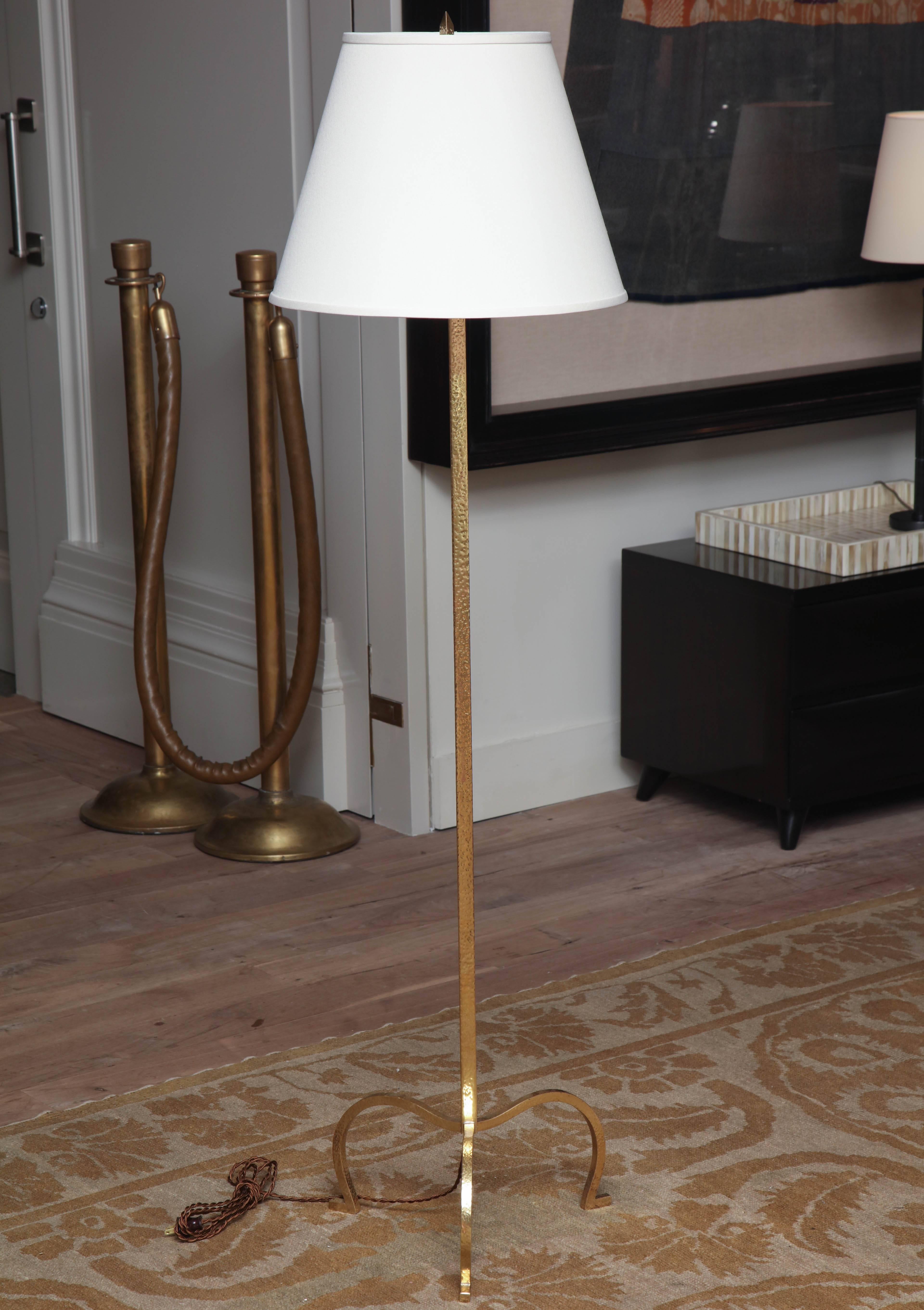 Hammered gold floor lamp from France, circa 1950.