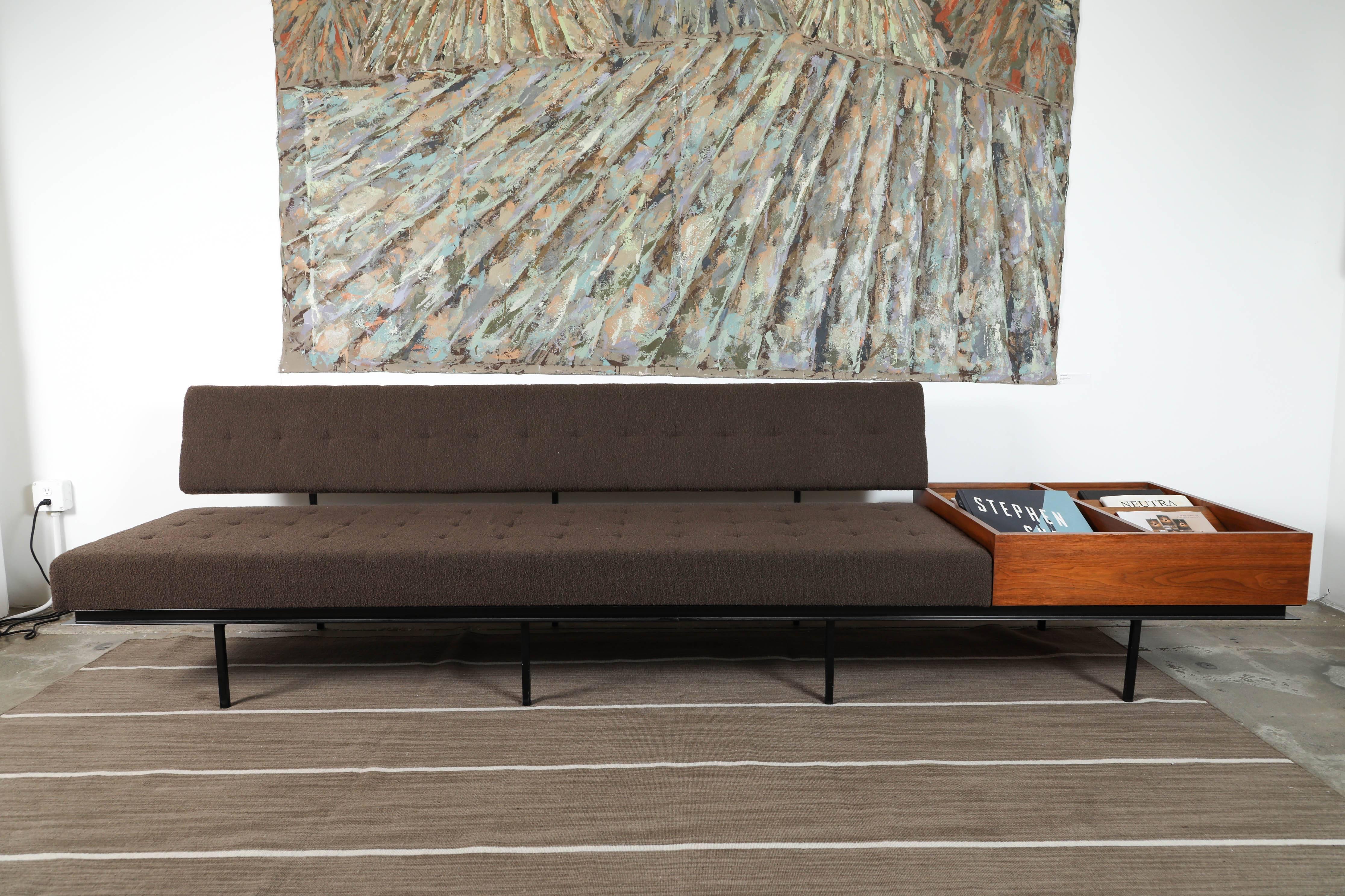 Florence Knoll sofa in chocolate bouchle fabric with a beautiful walnut side table attached. 

 
