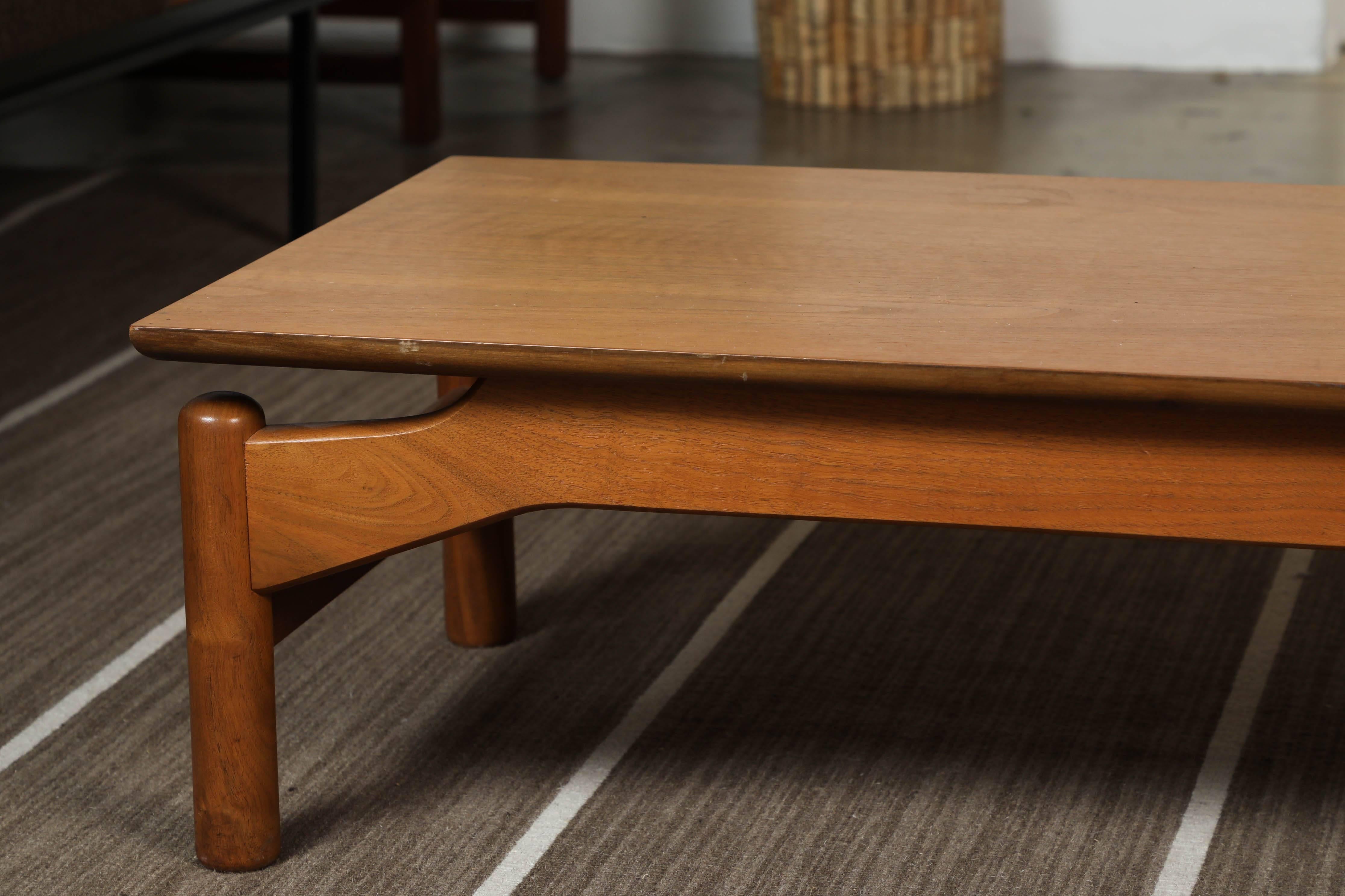 Wooden console bench by Greta Grossman.
Makes a great bench or low coffee table
Dark honey colored wood.