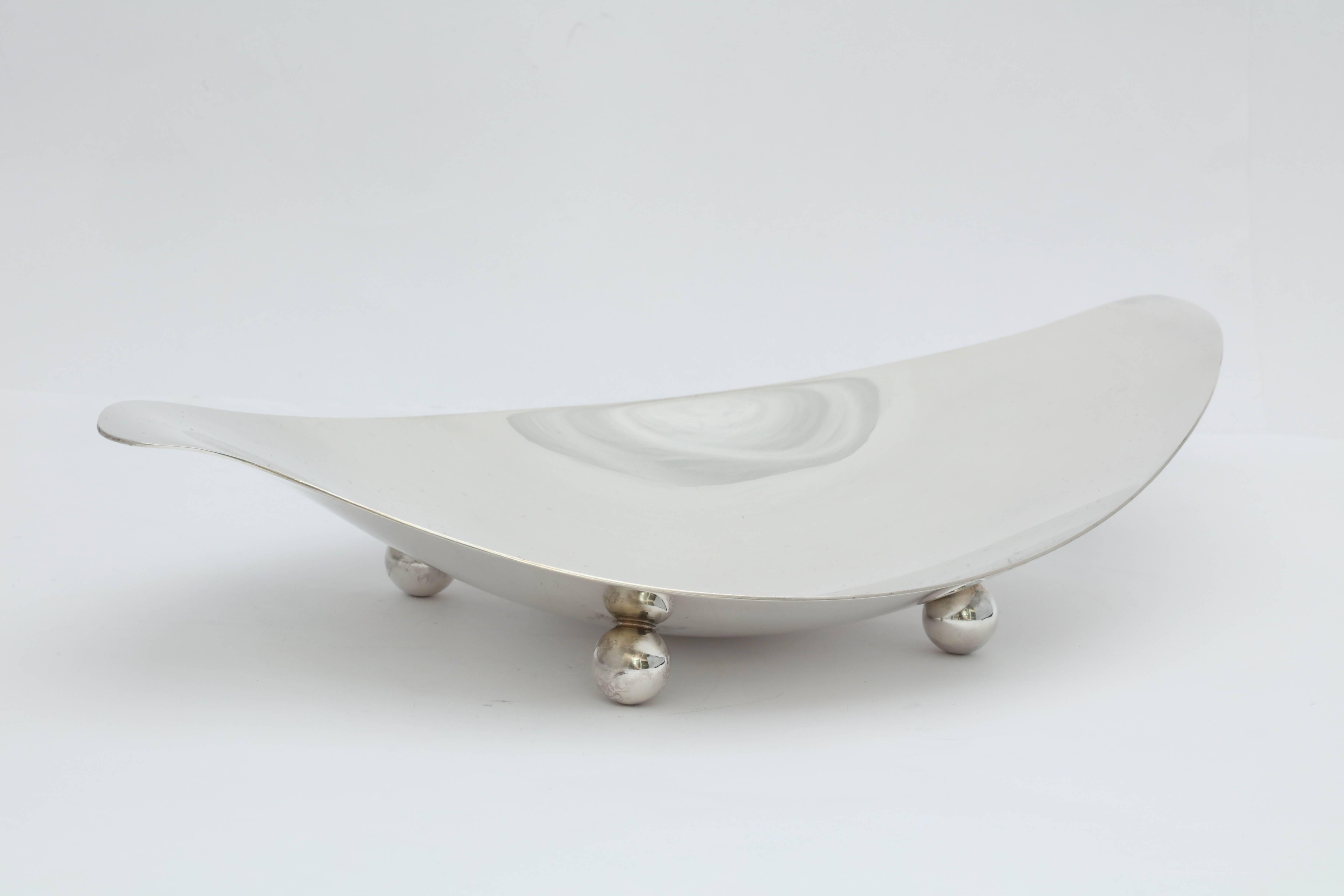 Tiffany, sterling silver, Mid-Century Modern, ball - footed serving dish, Tiffany and Co., New York, circa 1955. Measures: 10 inches long x 5 1/2 inches deep x 2 inches high at highest point. Weighs 8.950 troy ounces. Dark spots in photos are