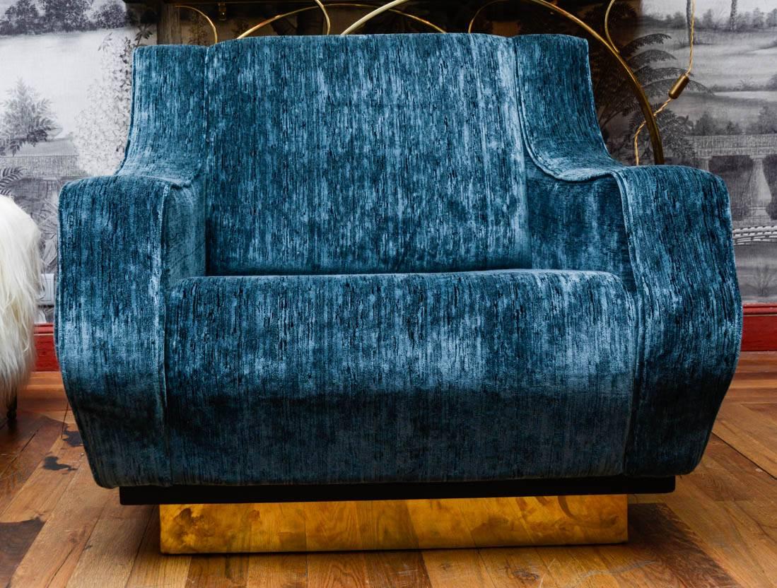 Pair of vintage armchairs upholstered with blue velvet, basement in brass.