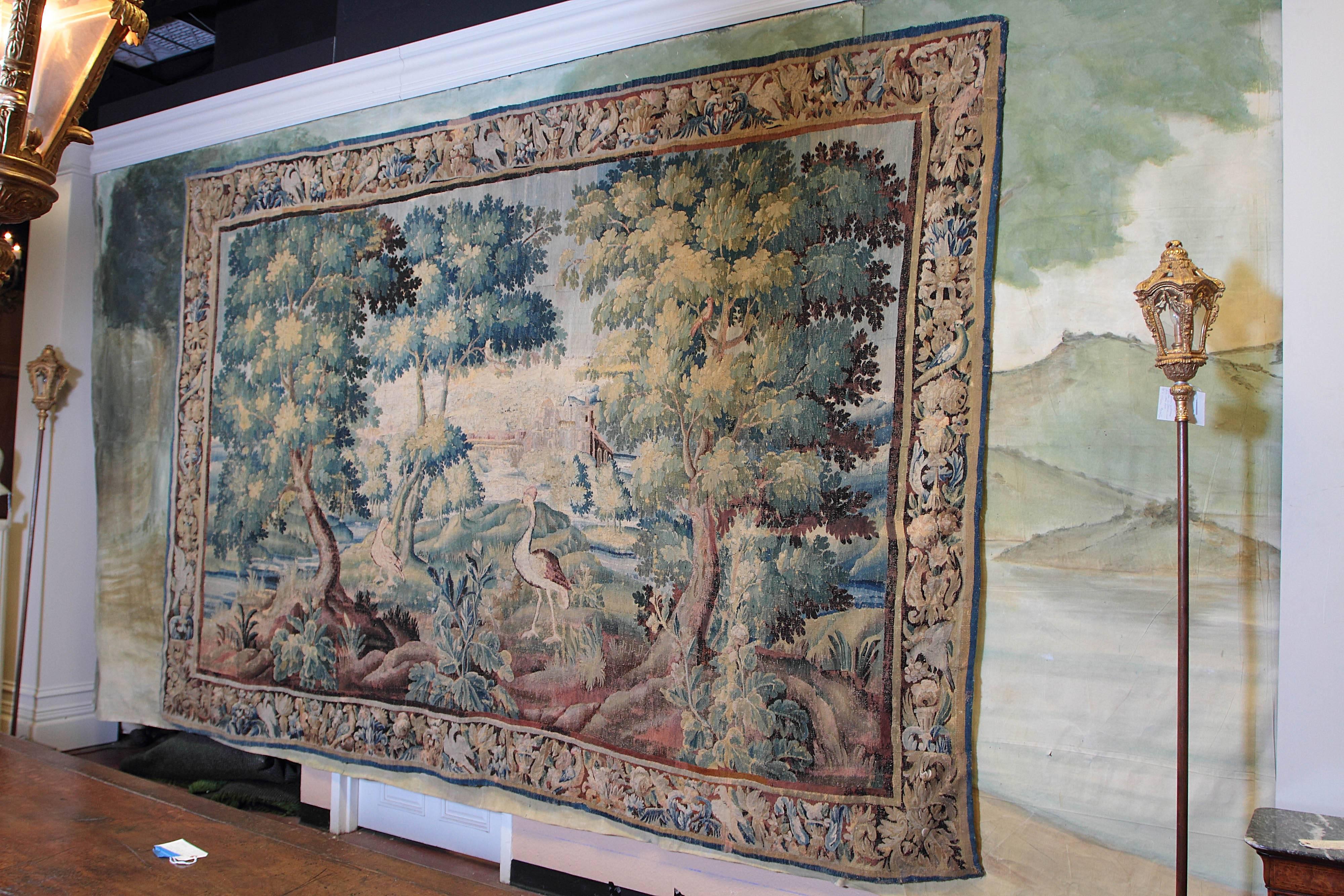 Monumental palace-size Flemish tapestry, depicting birds beside a stream in landscape.


 