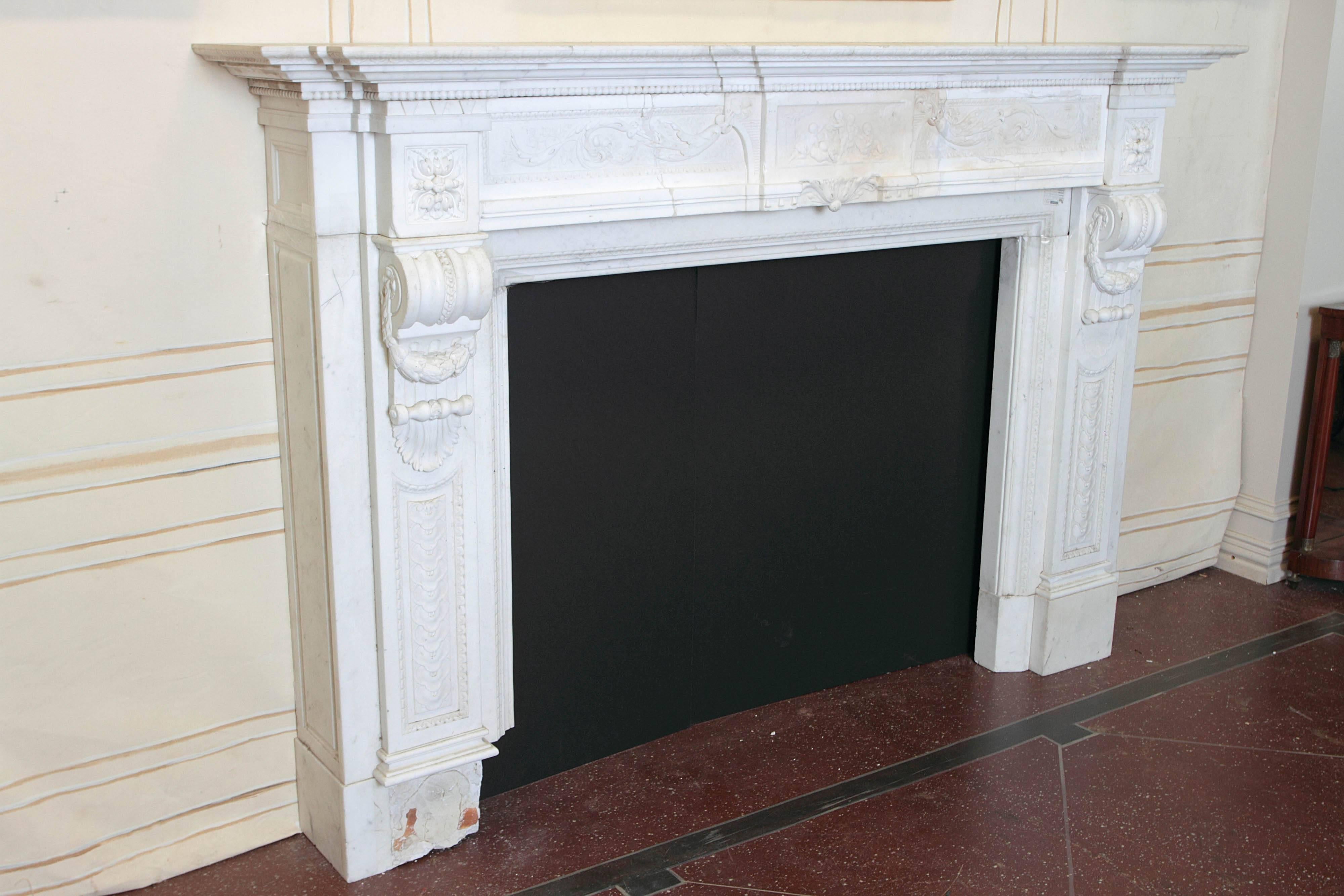 Late 18th century white marble Louis XVI mantel. Ornate relief carving on frieze.