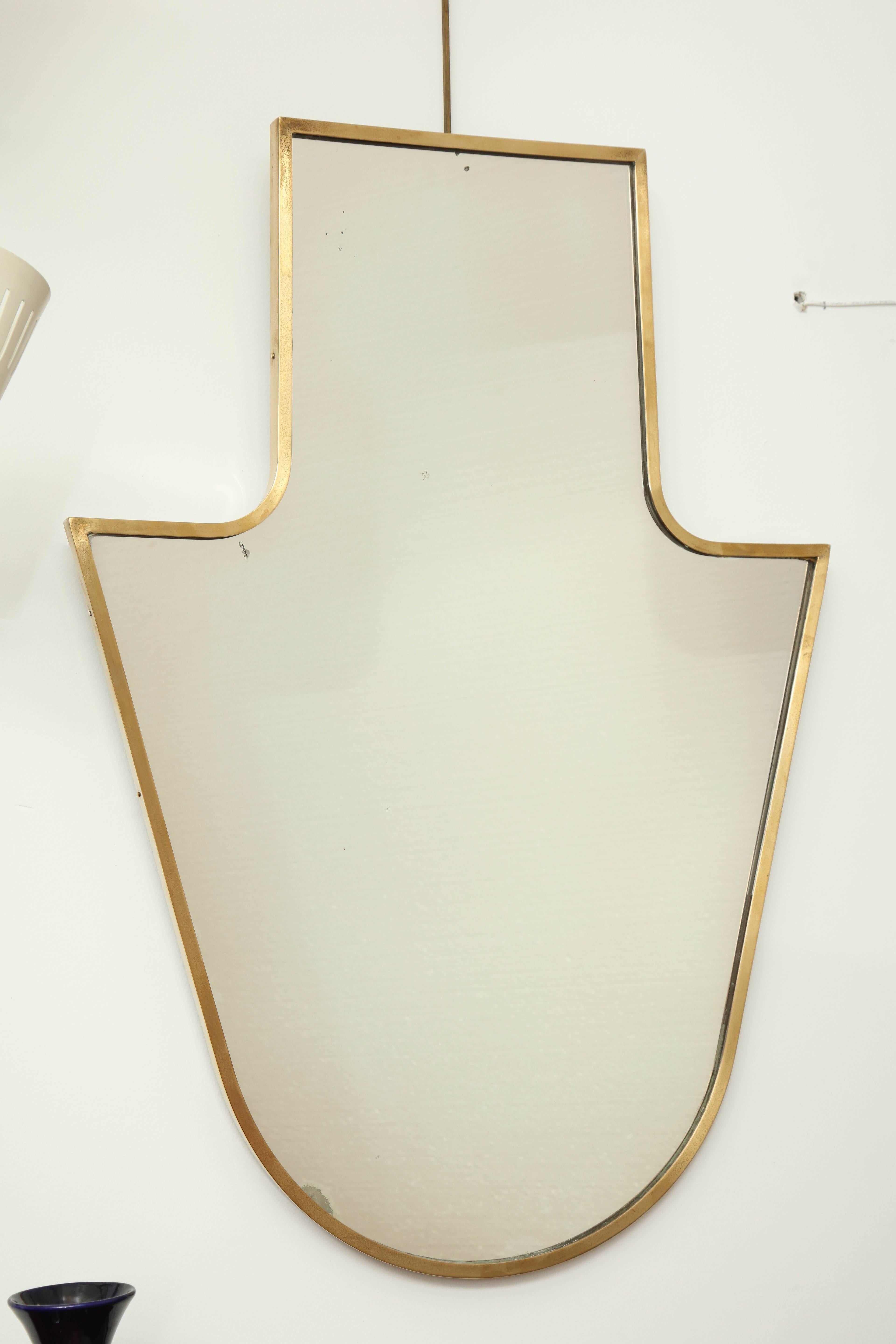 Brass shield shape framed mirror made in Italy 1940's, Gio Ponti style, great quality.
 
