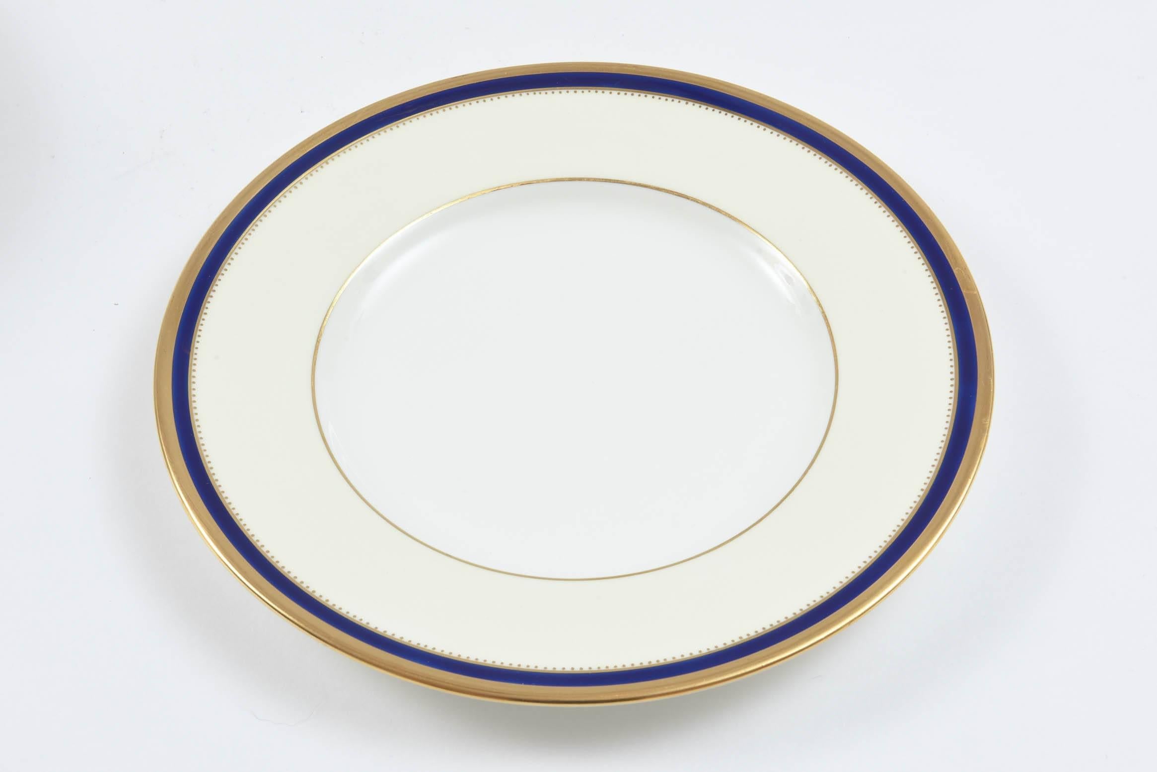 A great Classic set of plates perfect for so many courses, the go to size that you need more of. These have Minton's elegant white and cream background and collar with a thin band of cobalt blue and trimmed simply with gold. Very nice antique