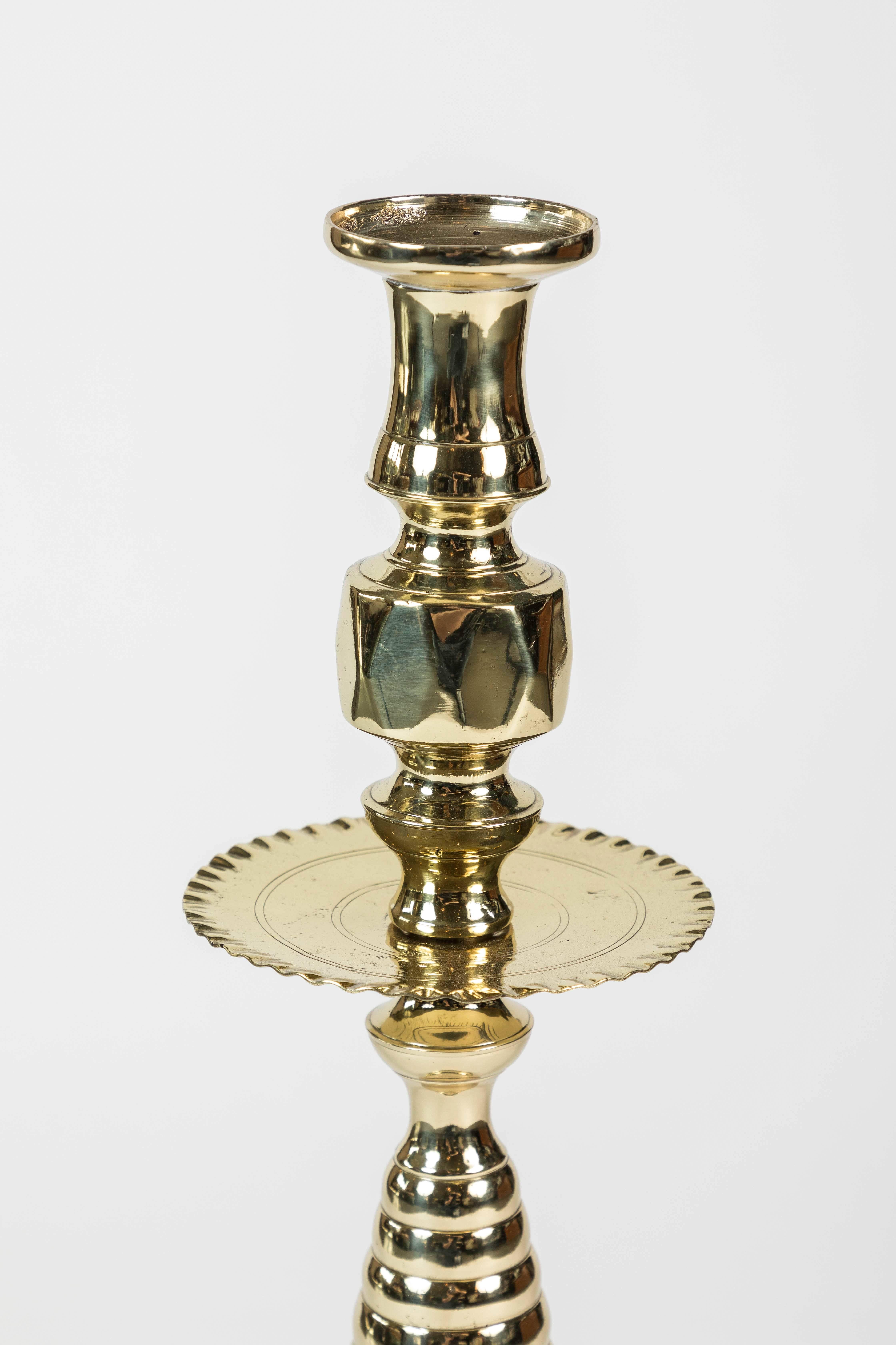 Large newly polished brass candleholder with beehive pattern stem and base, and “pie crust” edged wax catcher details, circa 1850-1900.
 