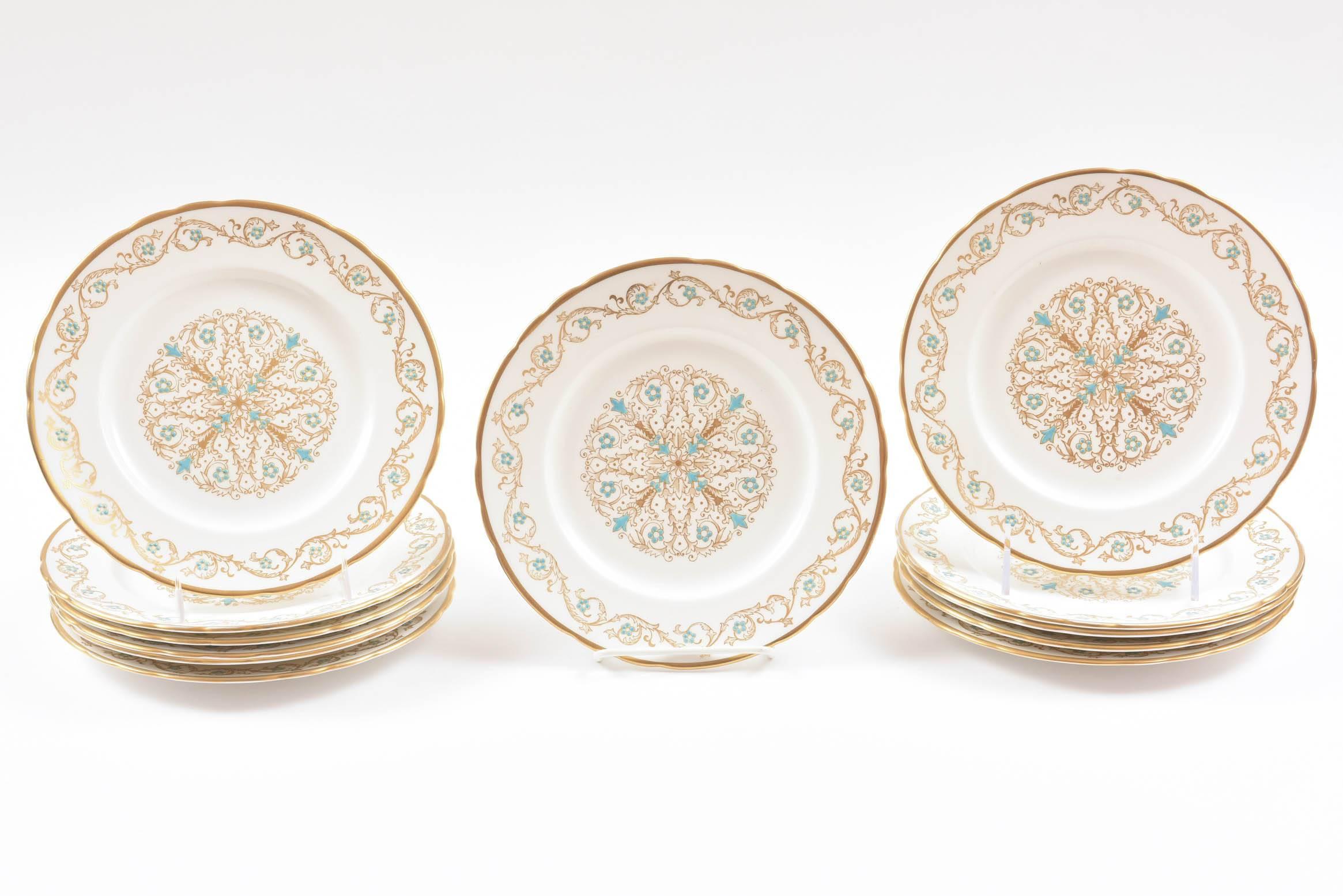 A sweet set of dessert plates with an all over gilt decoration highlighted with hand raised turquoise enamel. A slight scallop to the shape and it's the size you need over and over again for first course, salad, desserts, etc. In very nice vintage