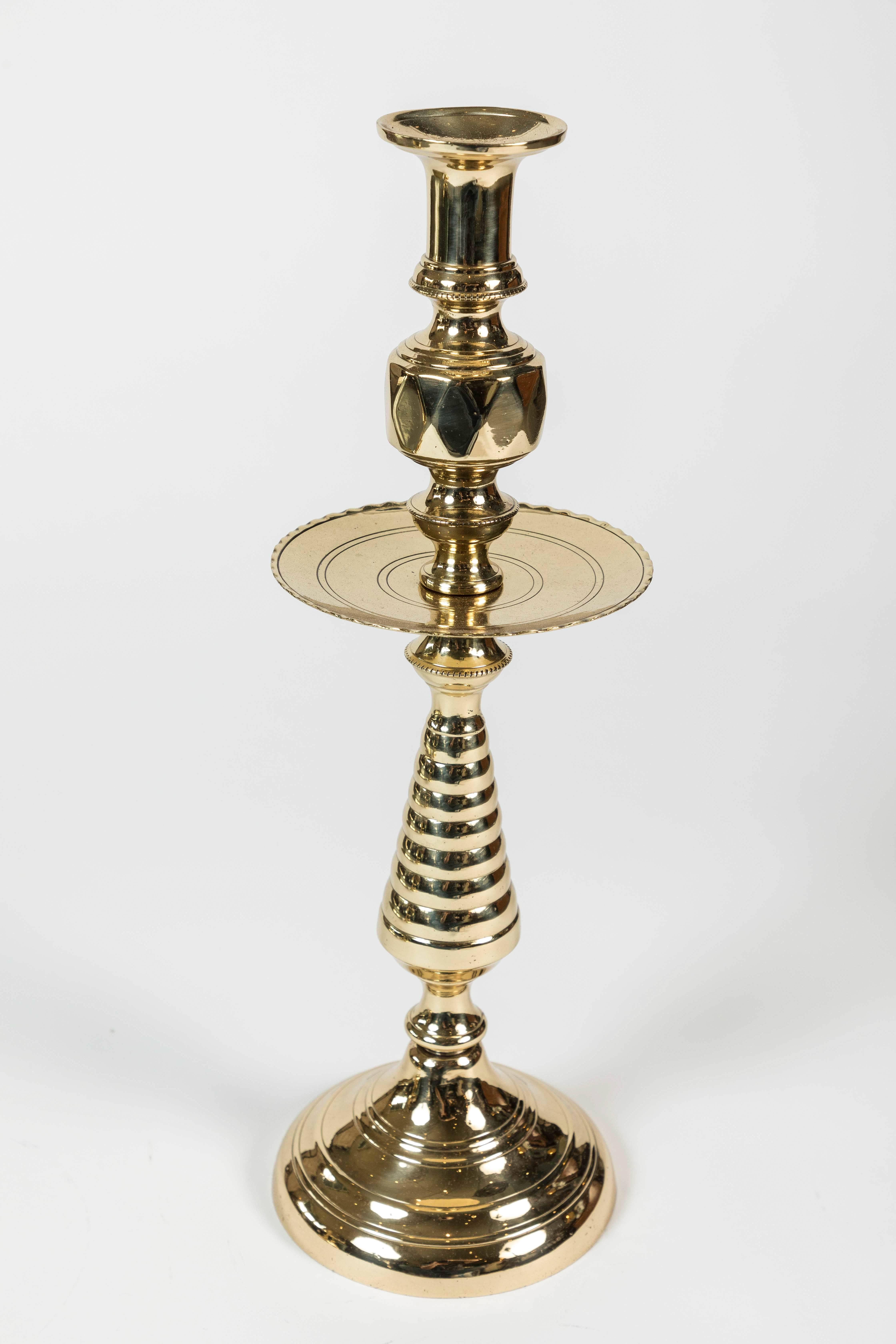 Newly polished brass candleholder with beehive pattern stems and wide wax catcher with crimped edge detail, circa 1850-1900. 17