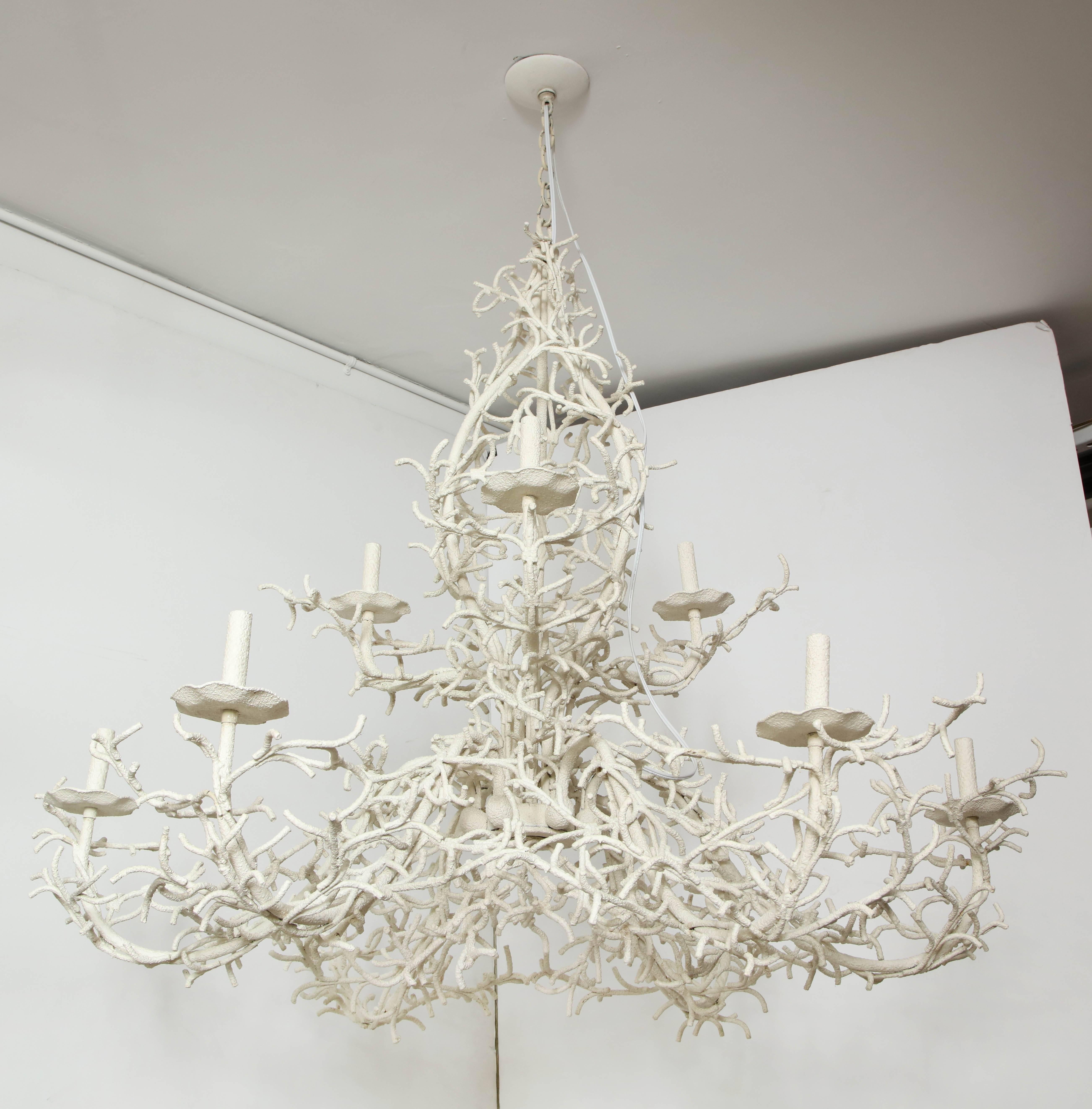 An exceptionally striking painted iron coral-like chandelier. This gem can take centre stage in a room and is special because of its large size and beautiful detailing. The lower tier consists of six arms, stemming from a centre disc, and the upper