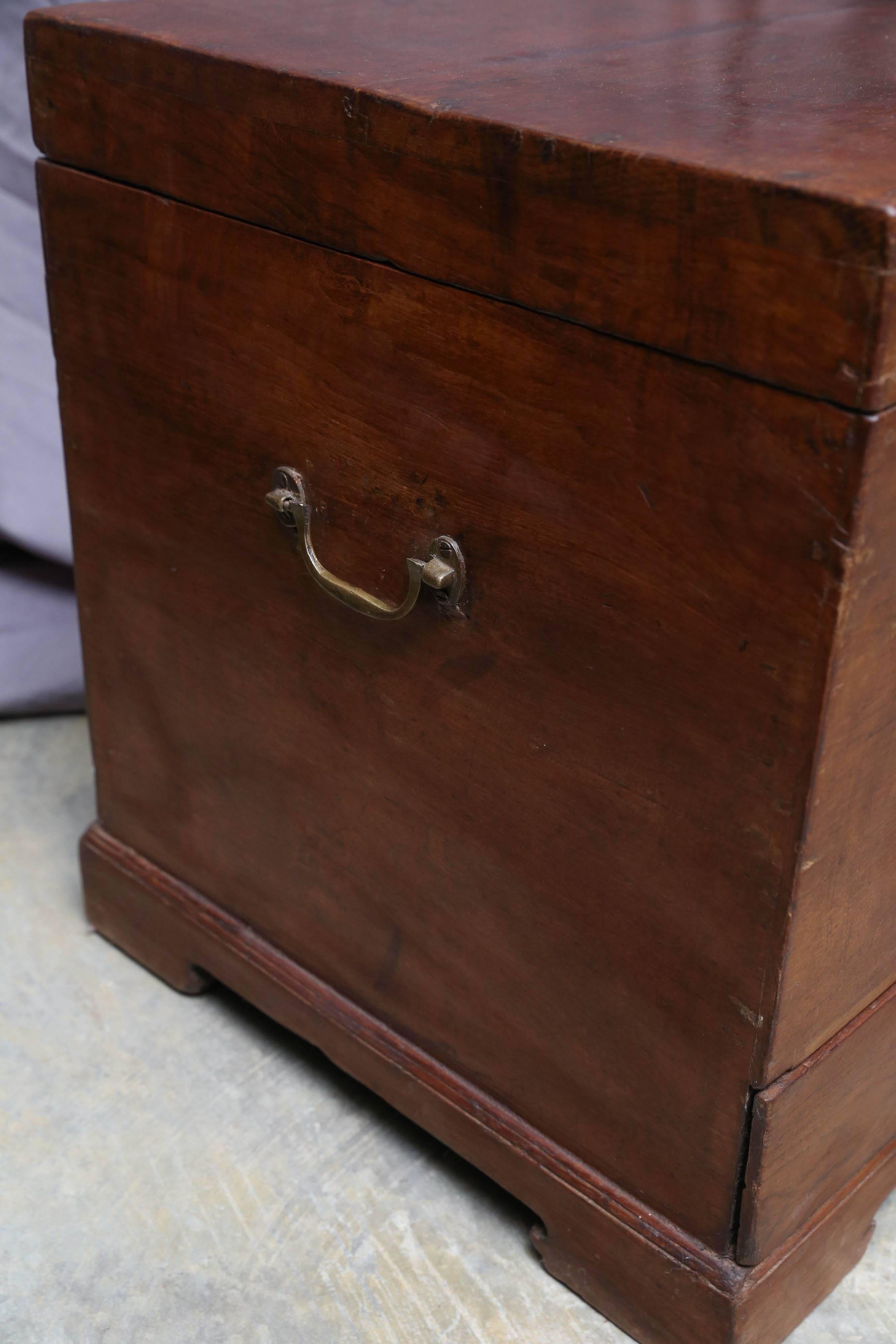 This custom-made teak wood box has two bottom drawers to keep jewelries and documents. It is made using handmade mortise and tenon joints. Primarily used for storing clothes and essentials like pocket watches etc. It retains all original solid
