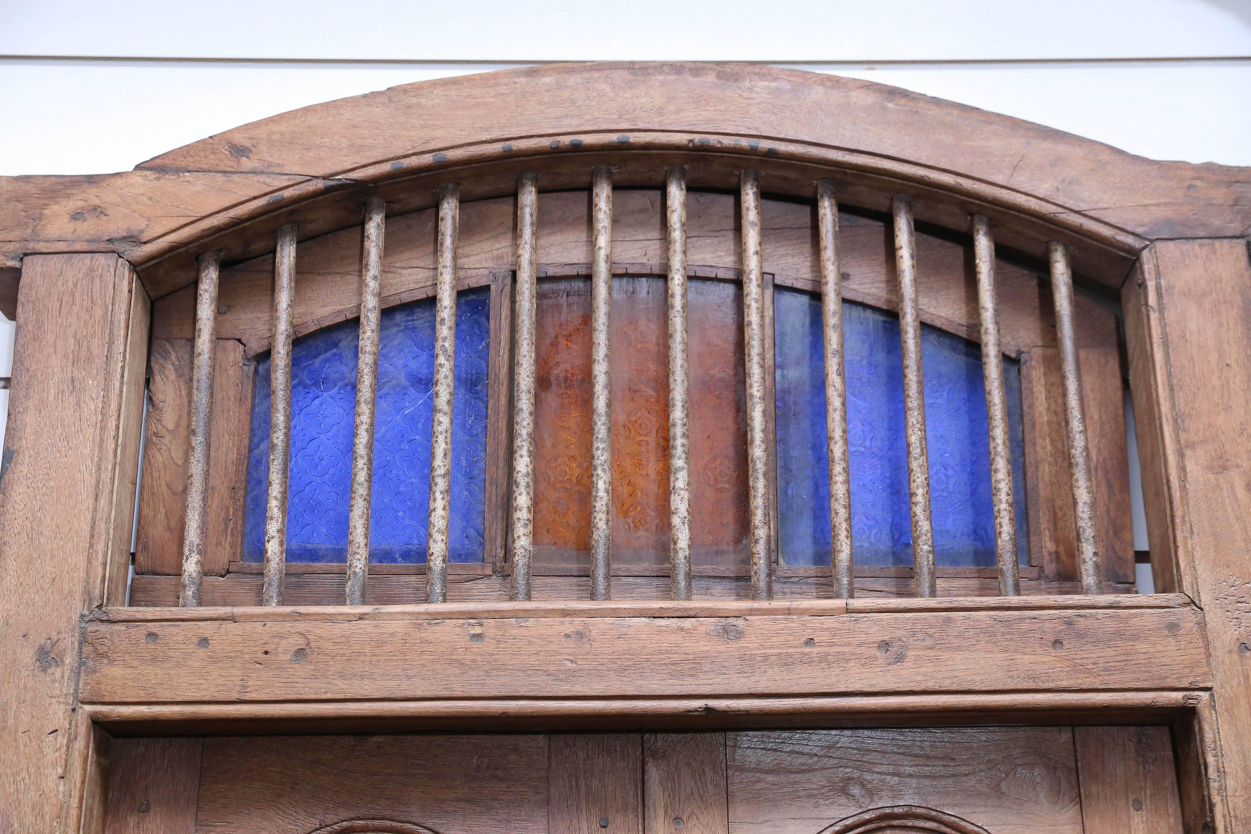 A very rare exceptionally well made solid teak wood window with original iron bars and hardware. It has shutters at the top. The churches built by the European settlers in the early 19th century are crumbling and are replaced with stronger concrete