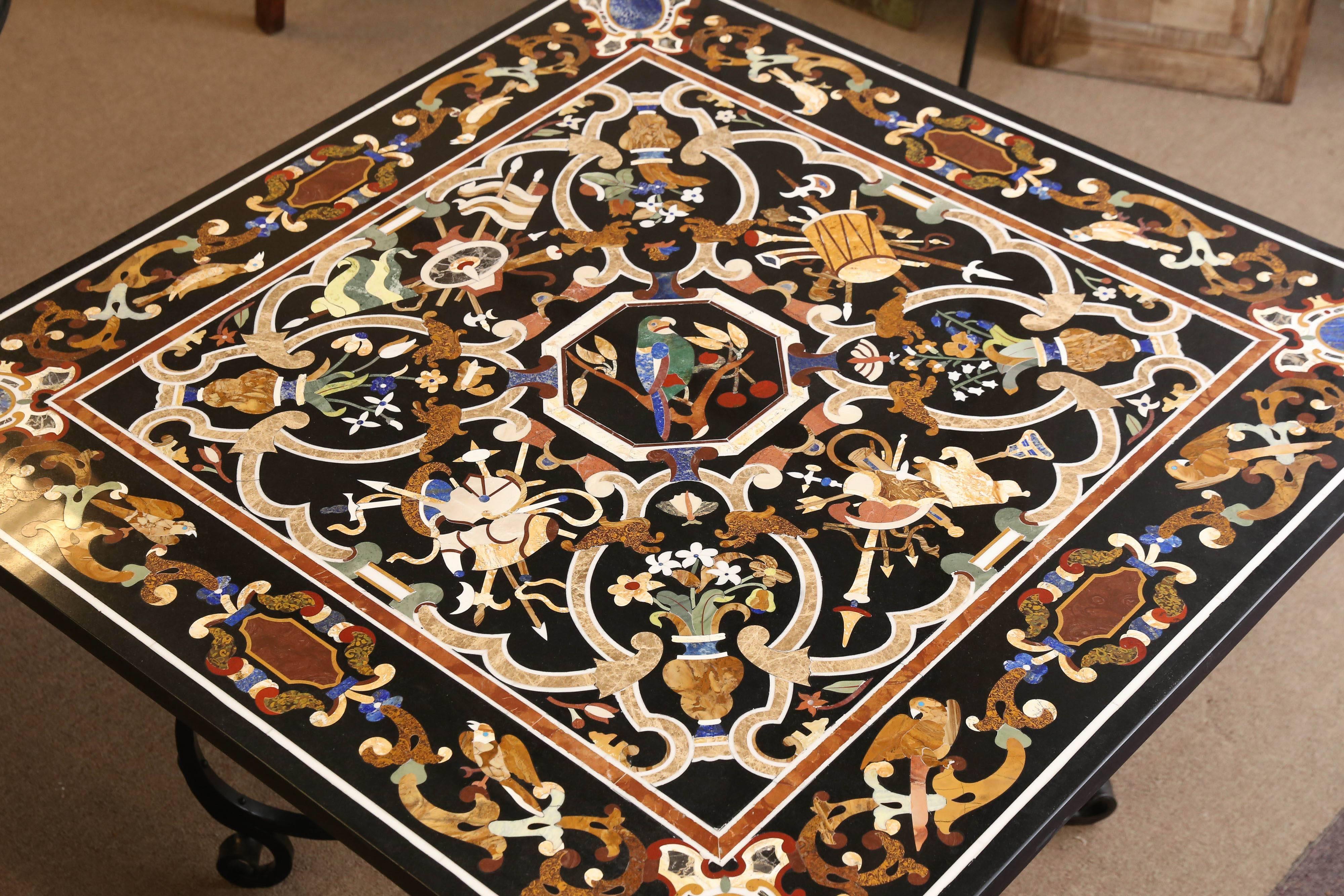 This entry table is exquisitely inlaid with semi-precious stones and other rare marbles. It is practically resistant to scratch. Animal figures like birds and plant leaves from Italian folklore are inlaid with precision and details. A great table by