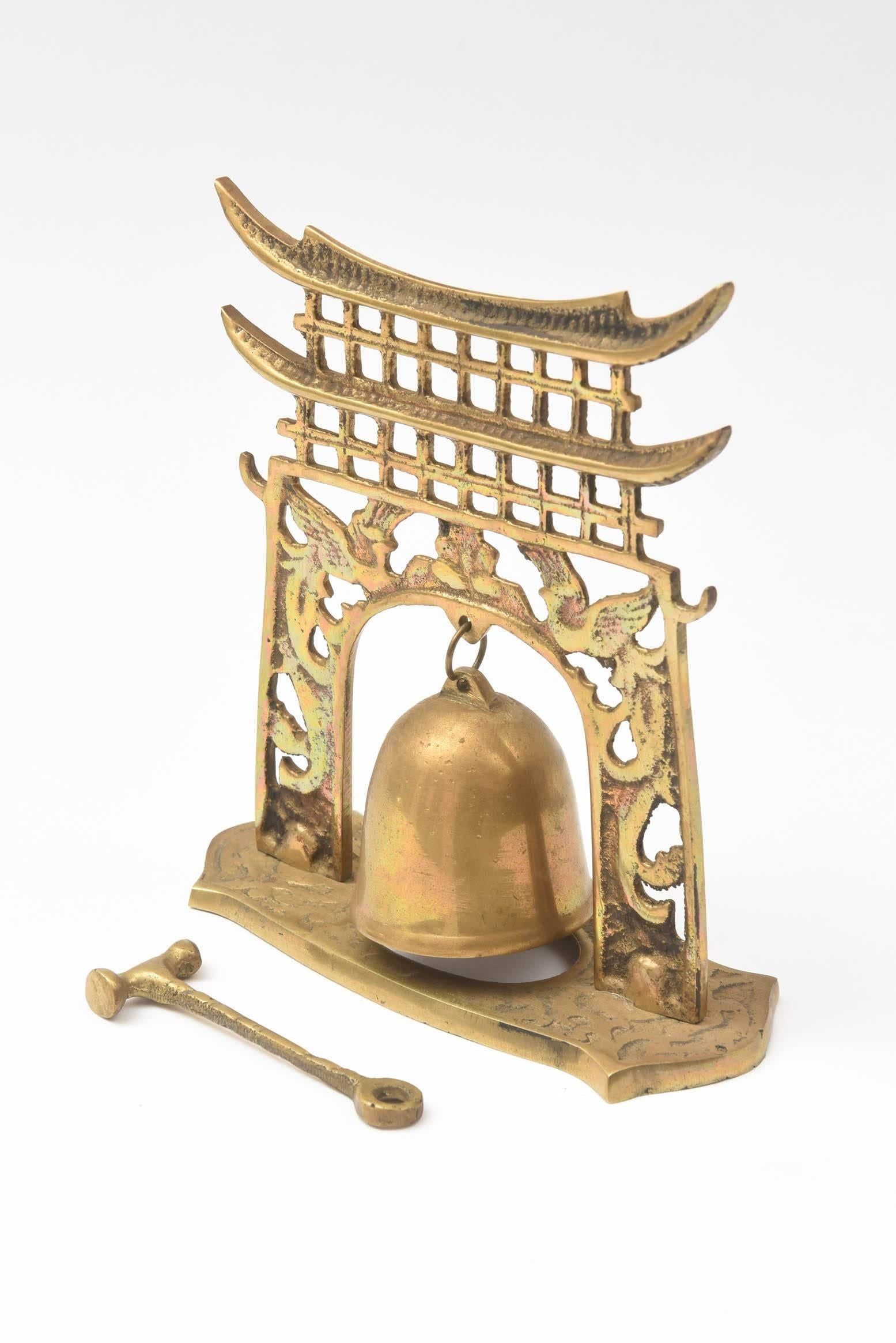 A charming pagoda styled dinner bell for the dining room or cabinet display. All original pieces and in really great vintage condition. 2 pieces total (bell and striker)