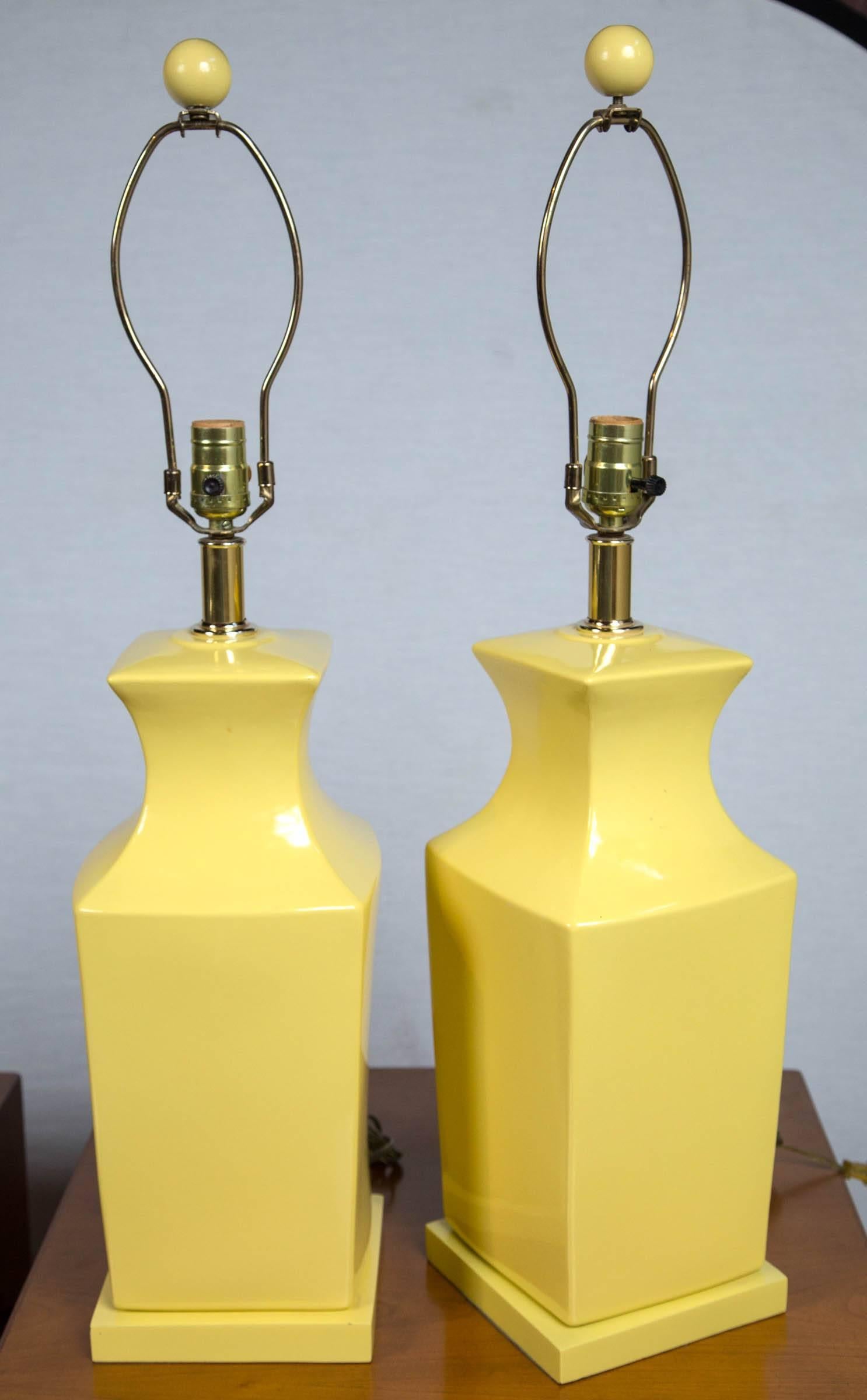 Pair of chinoiserie style yellow pottery lamps. Measures: 22
