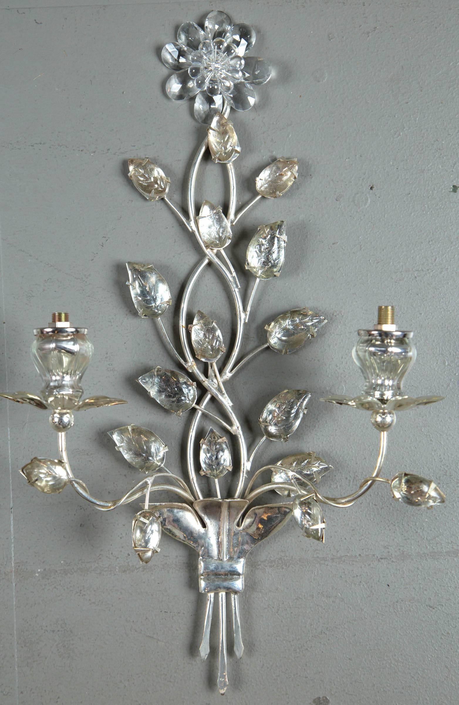 A set of 12 circa 1930 French silver plated sconces with double lights. $4,400 list pair; six pairs available.