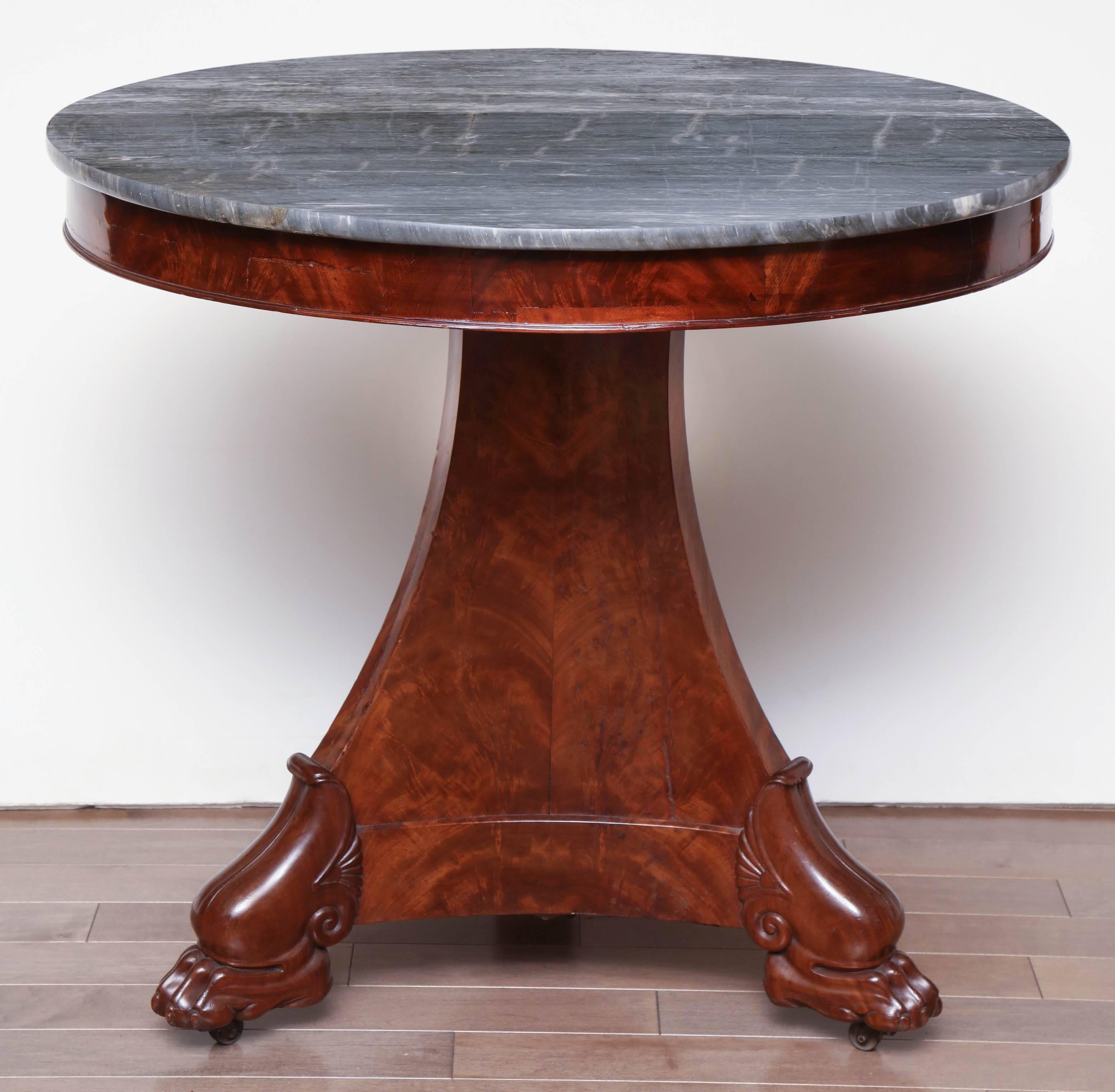 Early 19th century French, mahogany table with grey marble top.