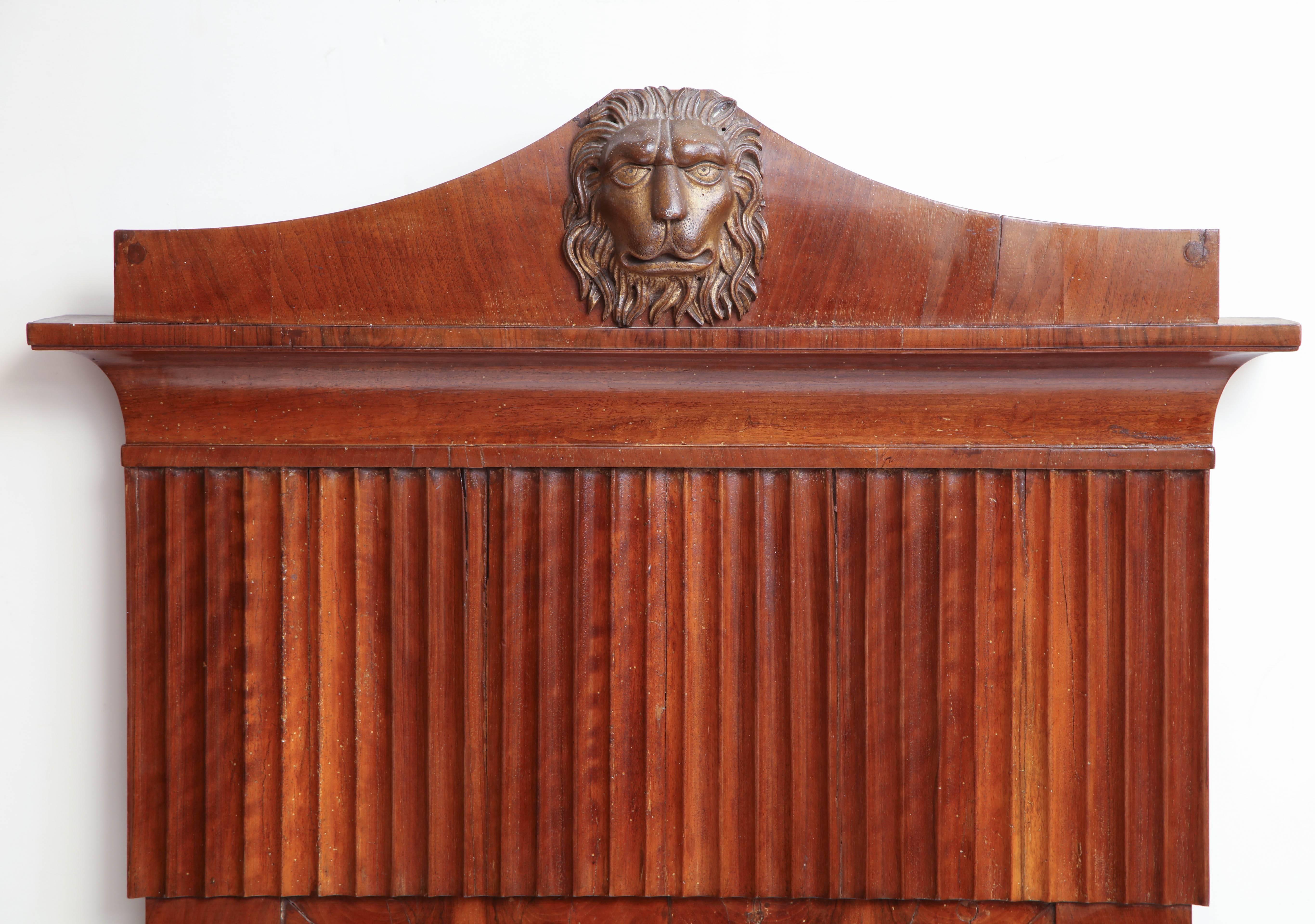 Italian neoclassical walnut mirror with lion mask.