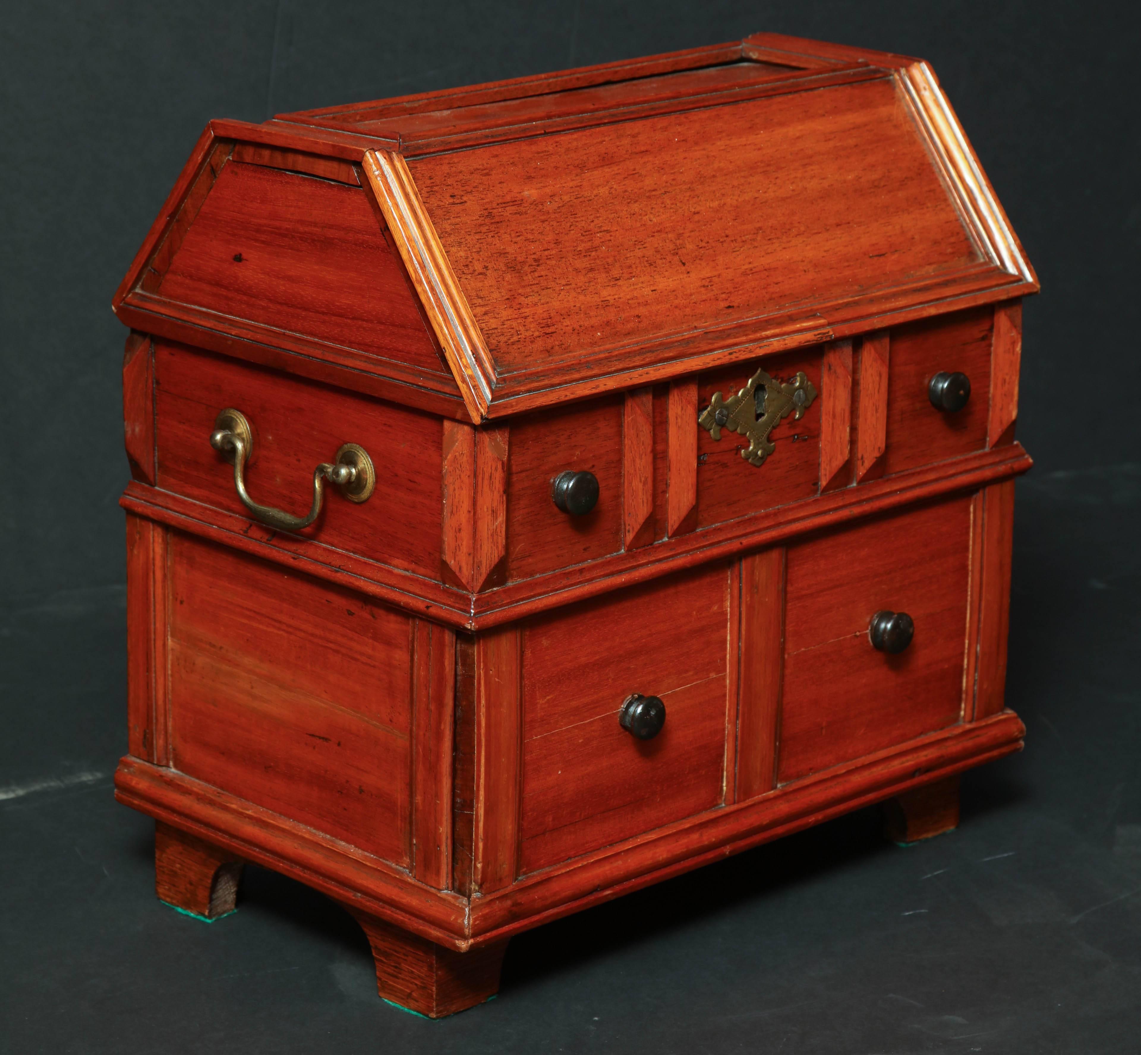 A rare English 16th-17th century walnut table cabinet or box with fitted interior drawers.