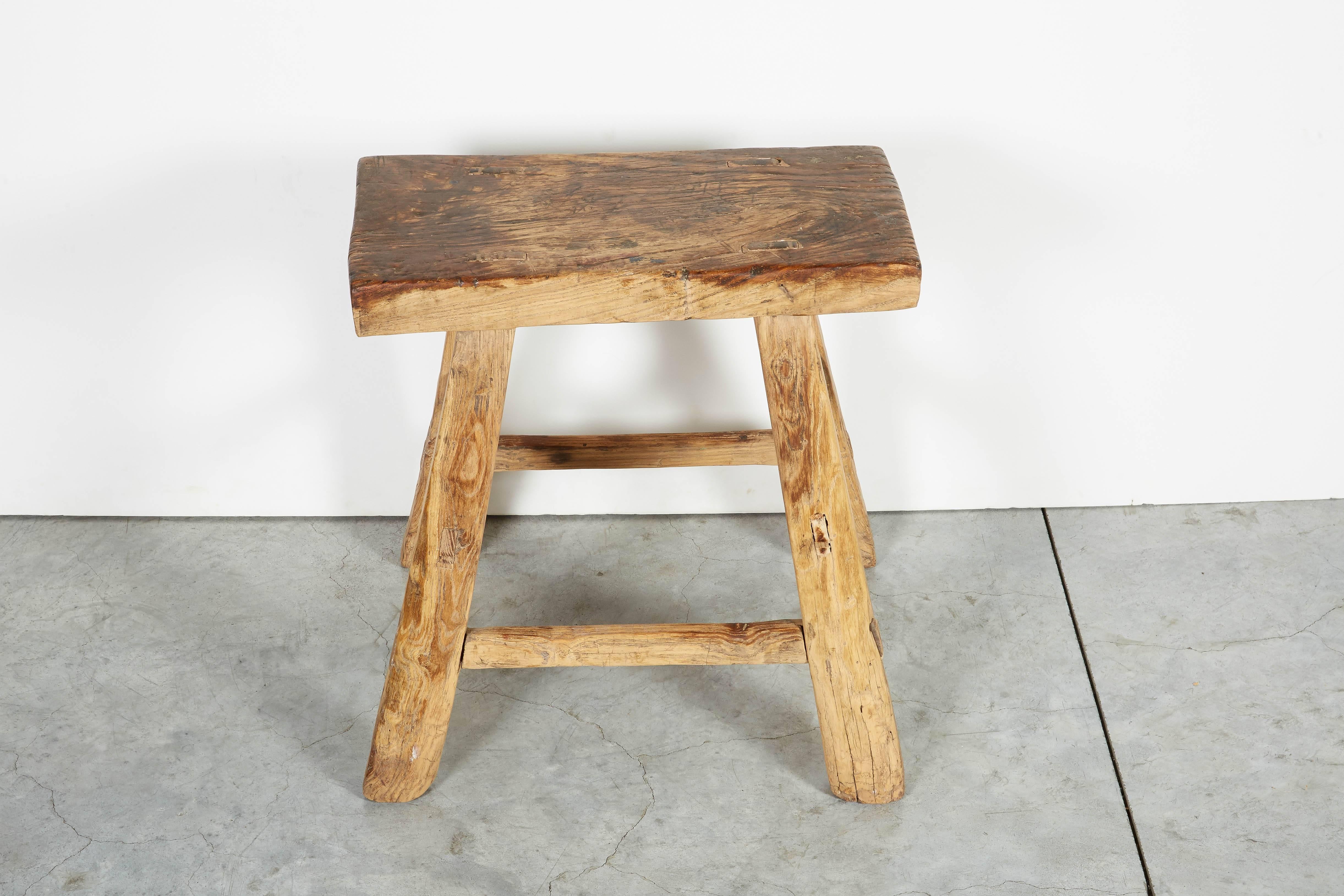A beautiful, classically shaped, antique mortised Chinese elm stool displaying great wear. Lovely and useful in any space. From Shanxi Province.
S521