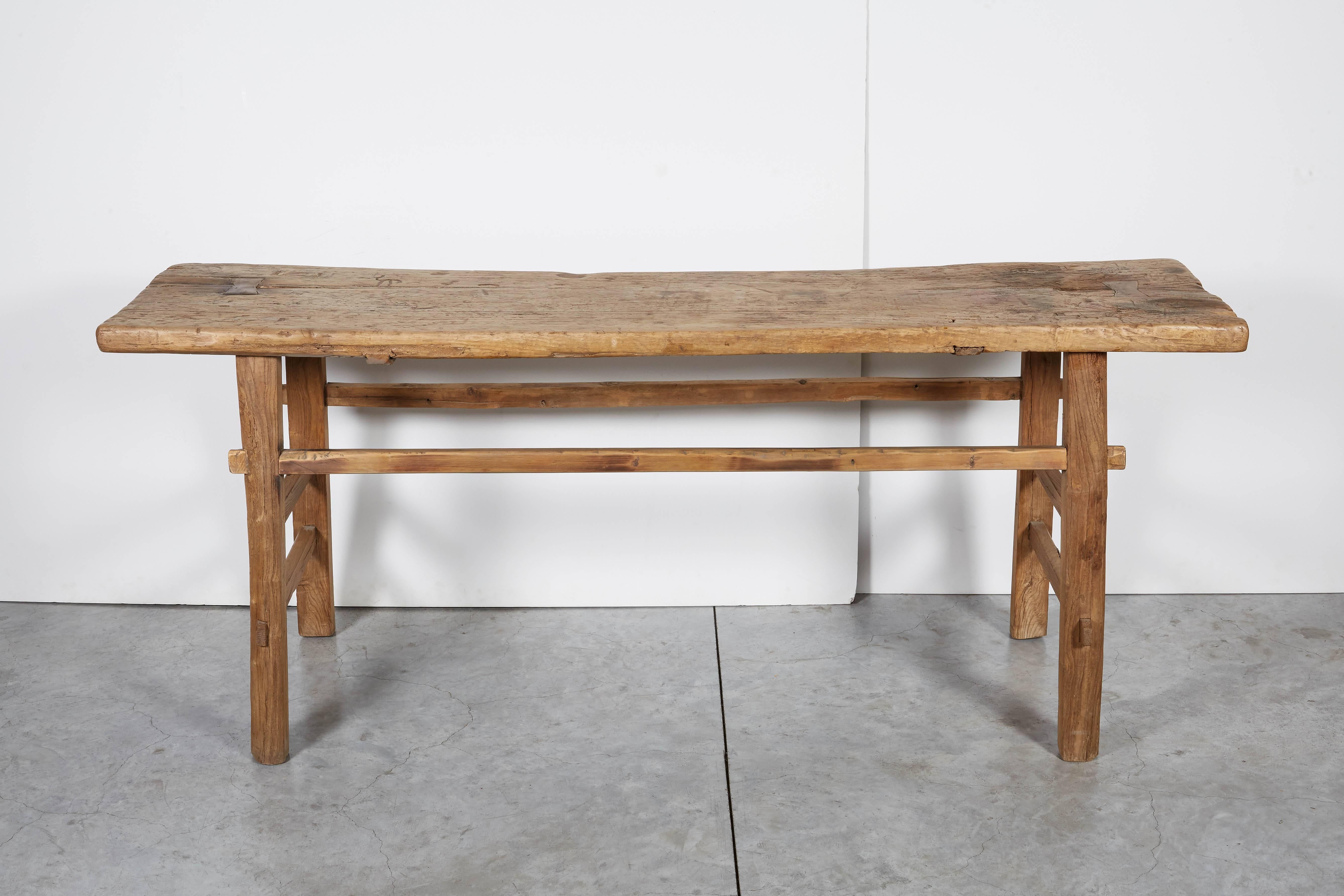 A classic, rustic Chinese farm table with beautiful patina and clean lines. This table is of a perfect height for use behind a sofa or against a wall beneath a painting. From Shanxi Province.
BN353.
 