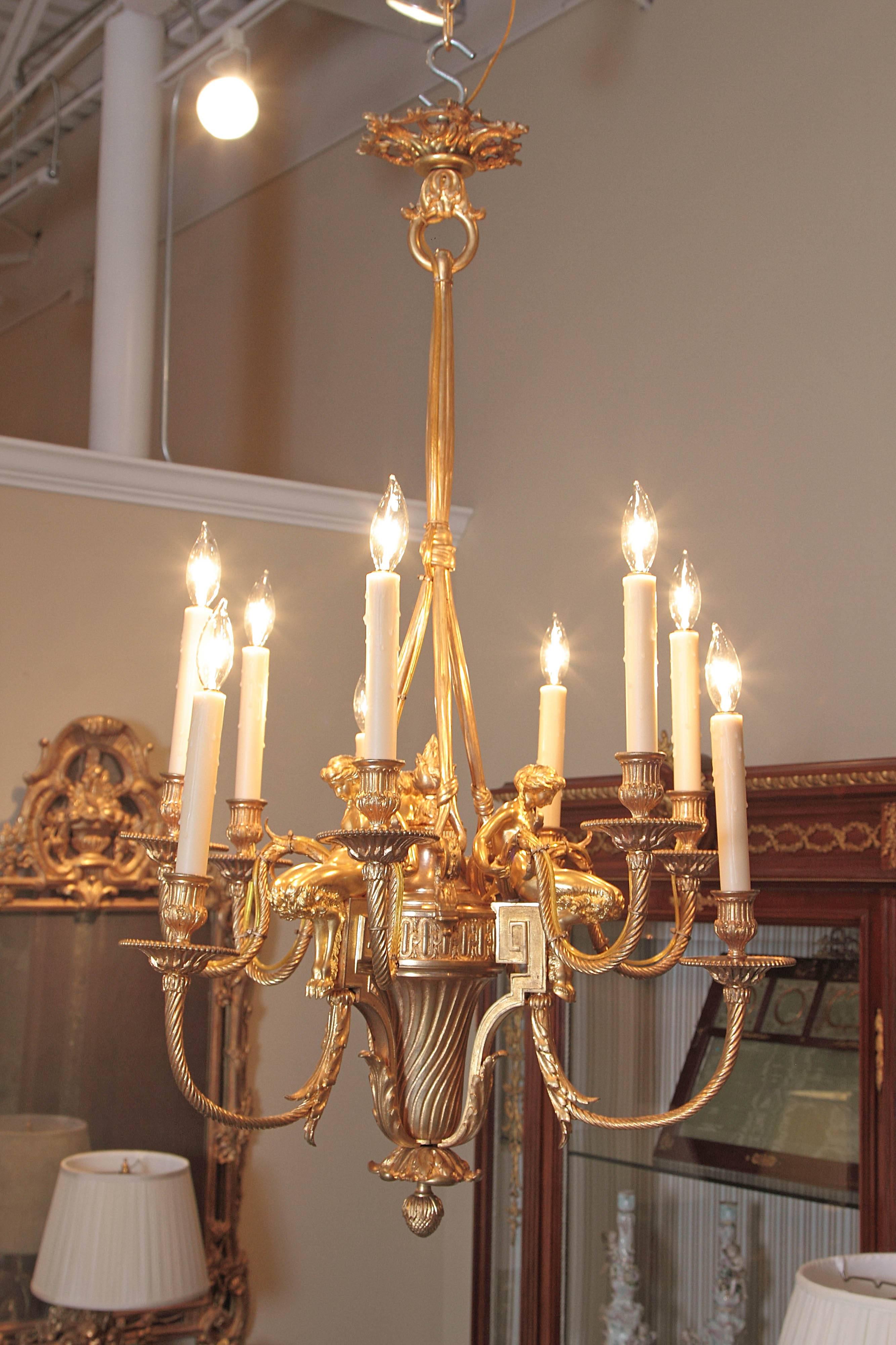 19th century French Louis XVI gilt bronze chandelier. Fine quality gilt bronze detail with female figures seated on top.