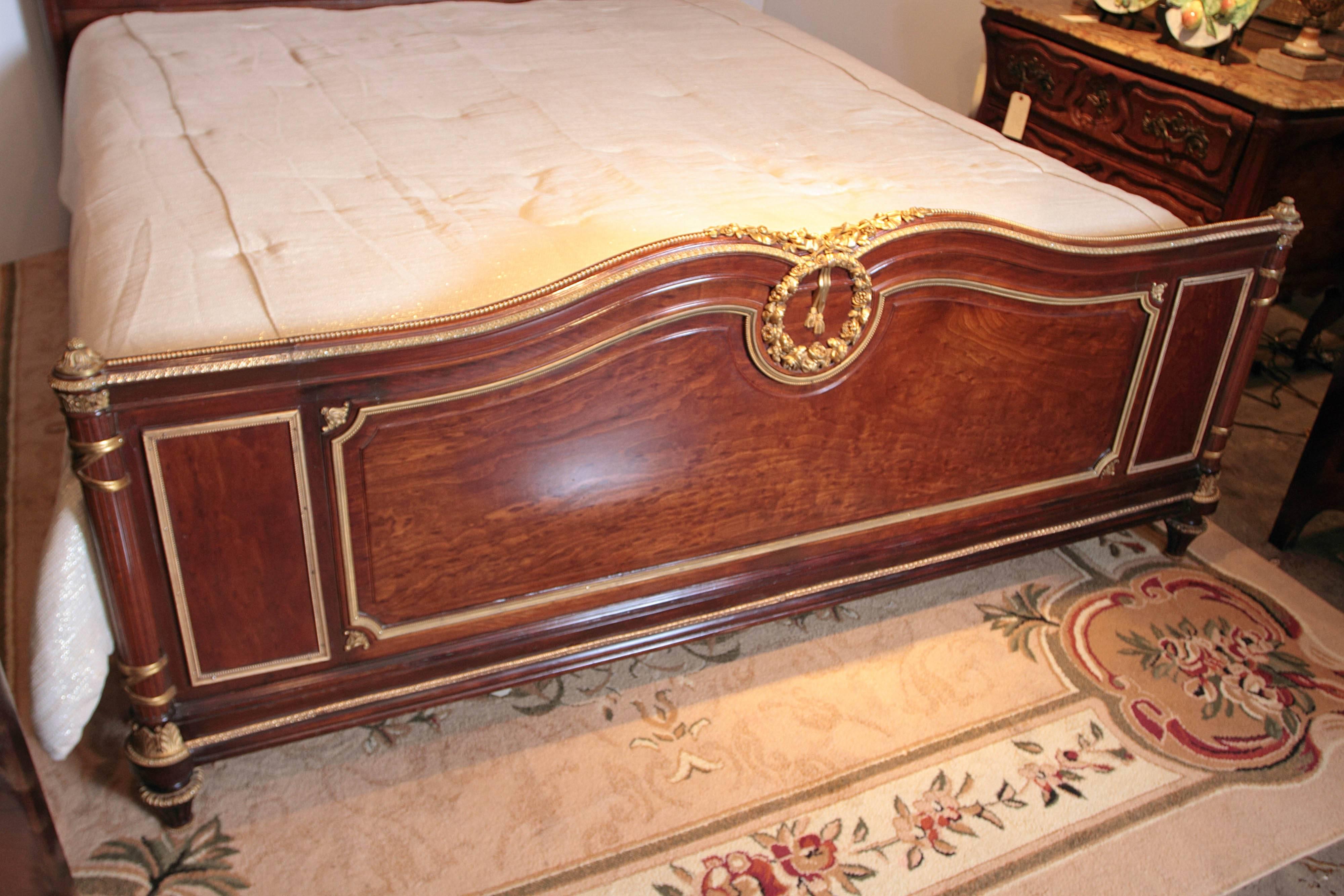 19th century French mahogany and gilt bronze trimmed king-size bed. Fine detail.