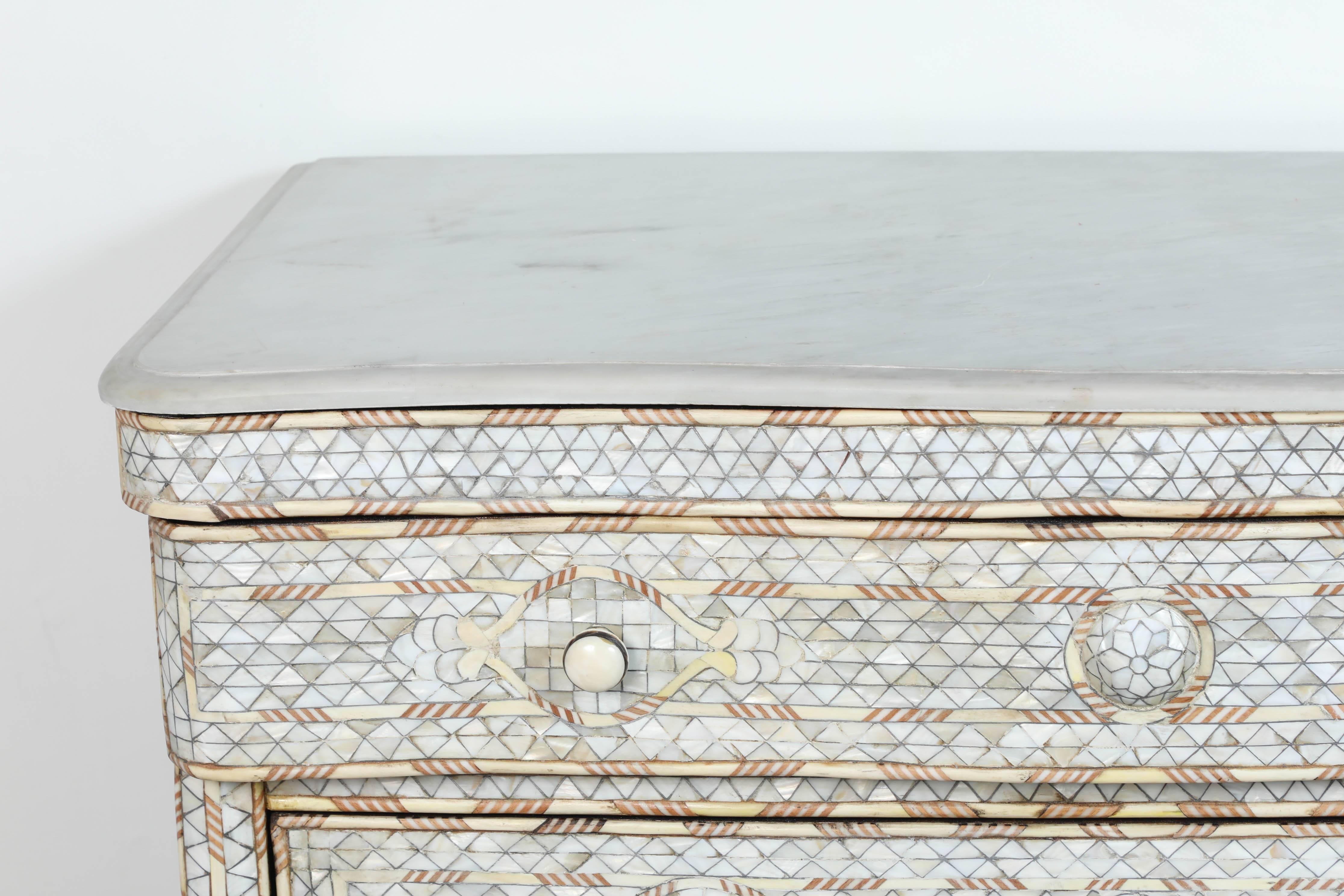 Fabulous pair of Middle Eastern Syrian artwork, handcrafted white wedding dresser with three drawers, wood inlay with mother-of-pearl, shell and bone.
Syrian night stand with mother-of-pearl and bone inlay and white marble-top.
Moorish arches and