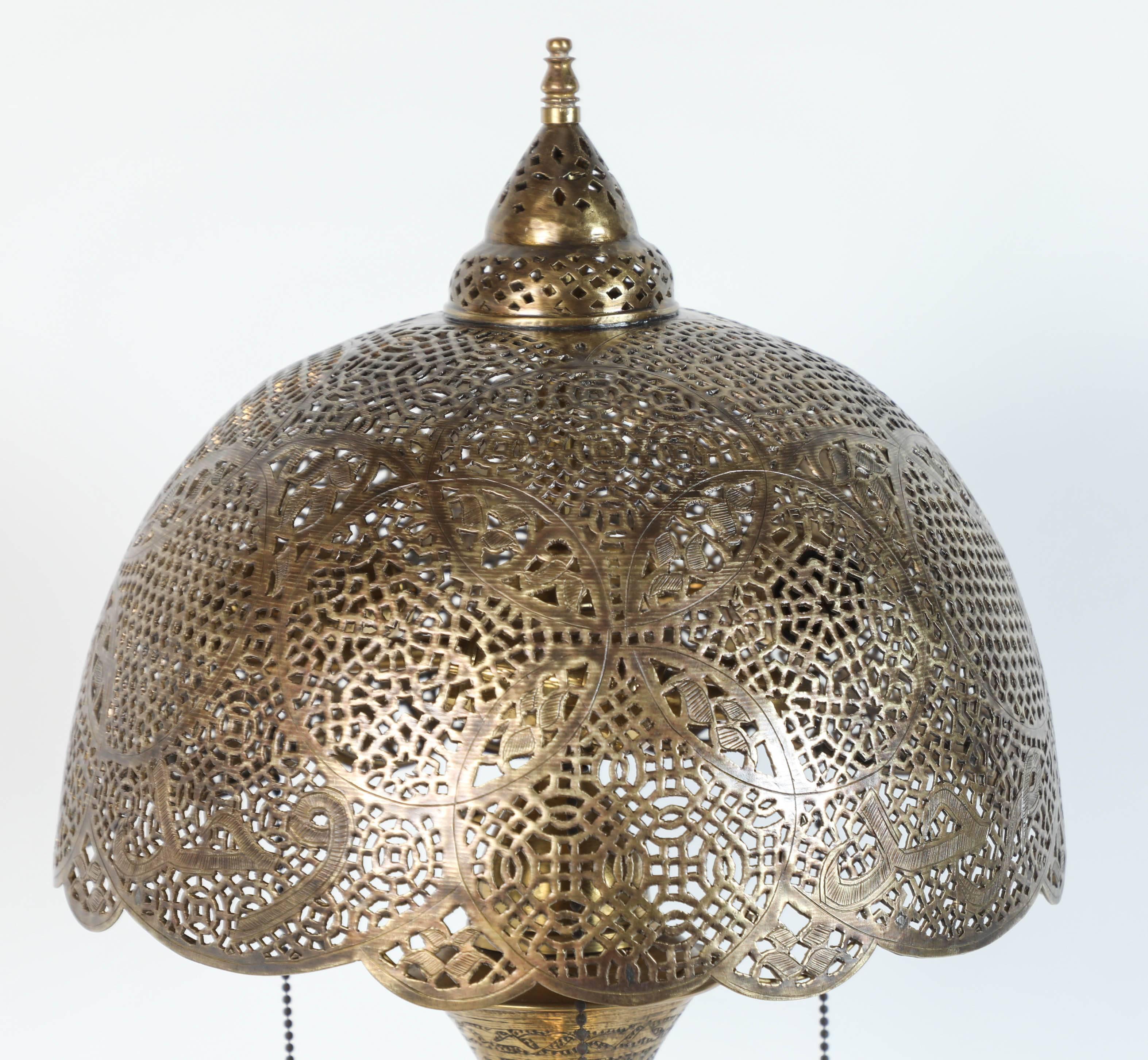 Very fine antique Middle Eastern Syrian Moorish revival with Arabic calligraphy writing.
Moorish Syrian brass table lamp with hammered brass with fine Islamic designs on stand and hand-cut filigree Persian style shade.
Rewired with three