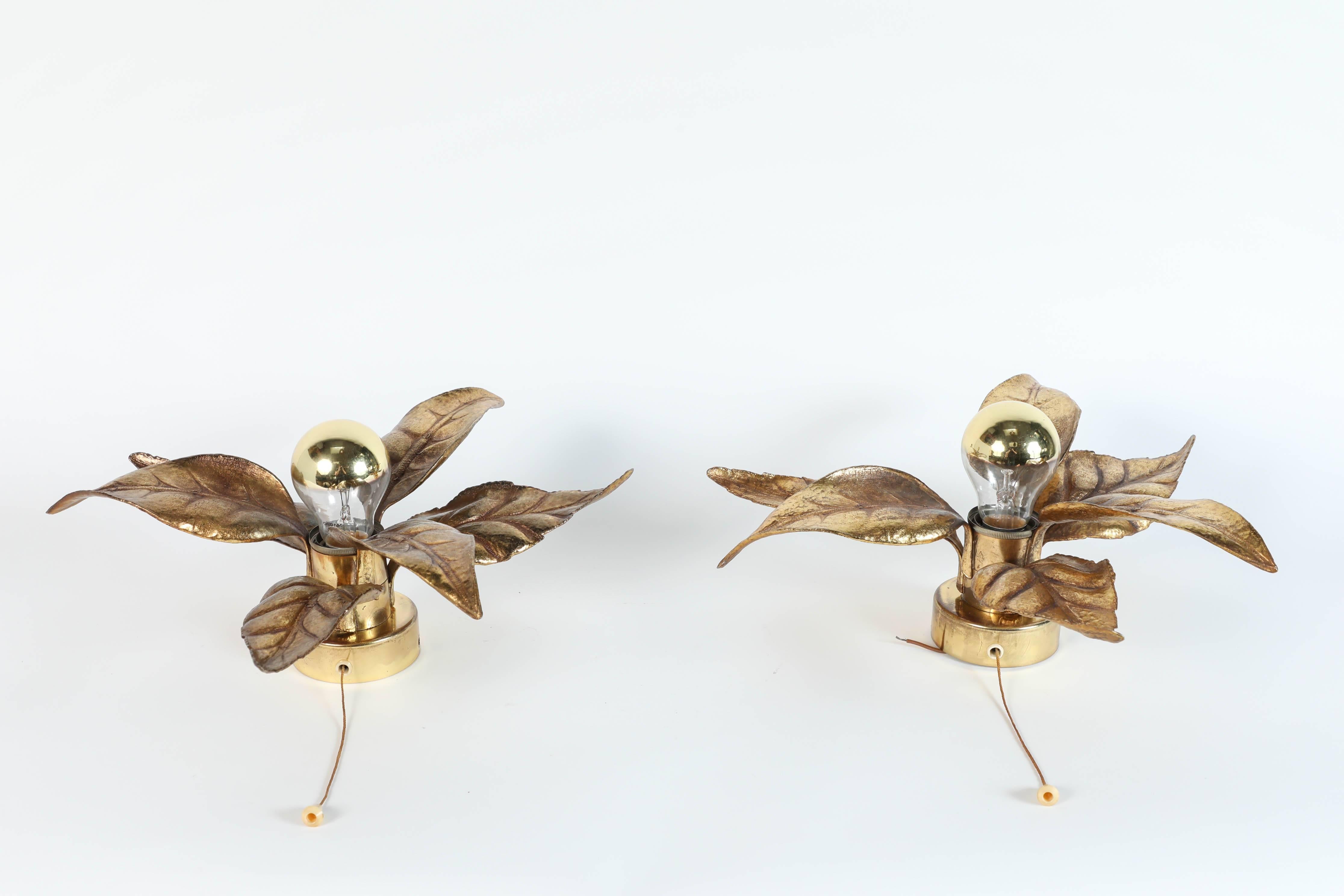 Set of two brass flower lights in the brutalist style of Willy Daro designer, by the Belgian lighting company Massive Lighting circa 1970s.
They have a wonderful naturalistic leaf shape and are very evocative of the 1970s era.
Can be used as wall or