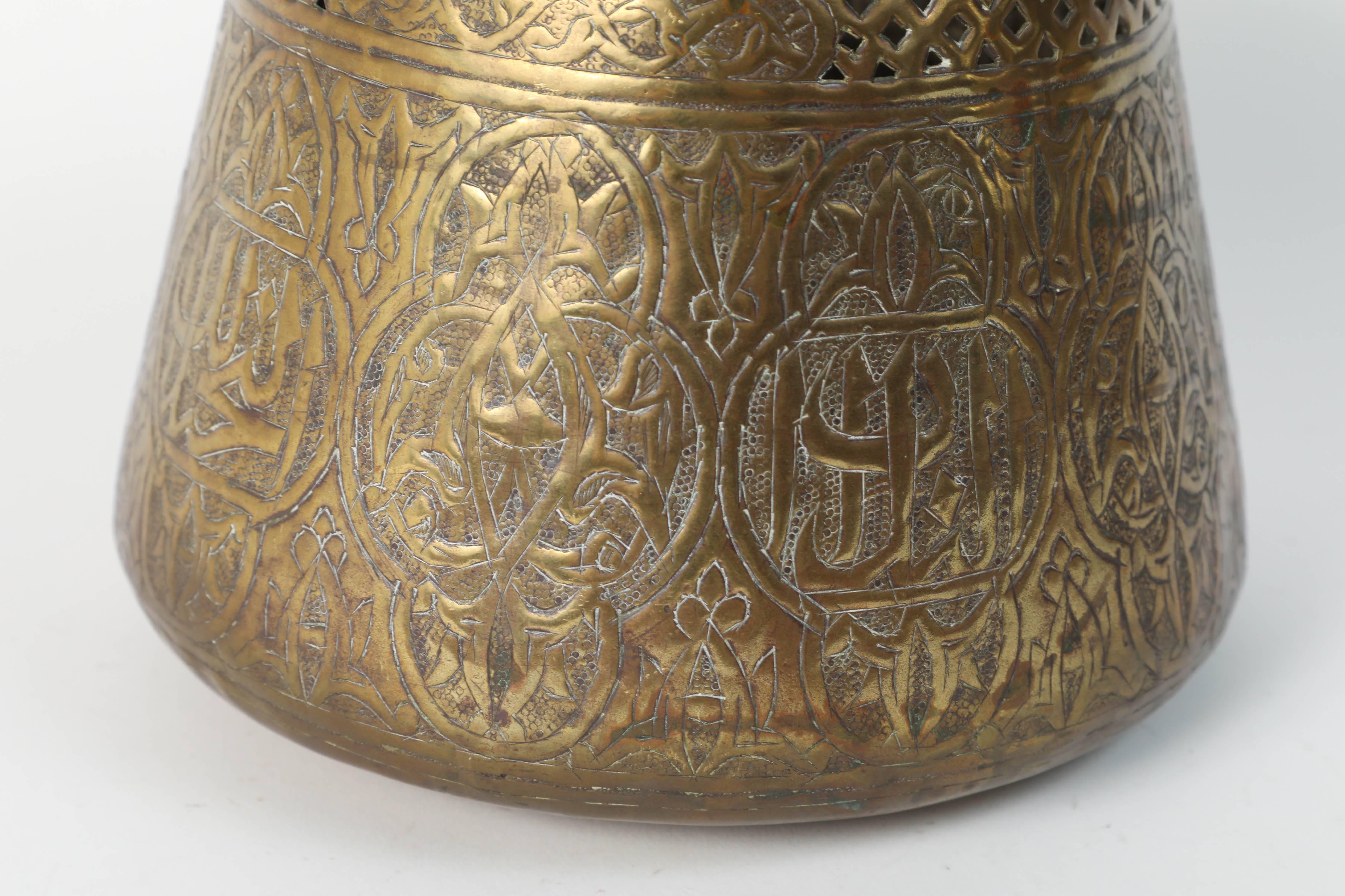 19th century Middle Eastern Islamic Syrian brass repousse bowl, finely hand-etched, engraved, hammered and chased with elaborate Moorish Syrian designs decorated with medallions of Arabic calligraphy inscriptions.
Handcrafted brass metal work by