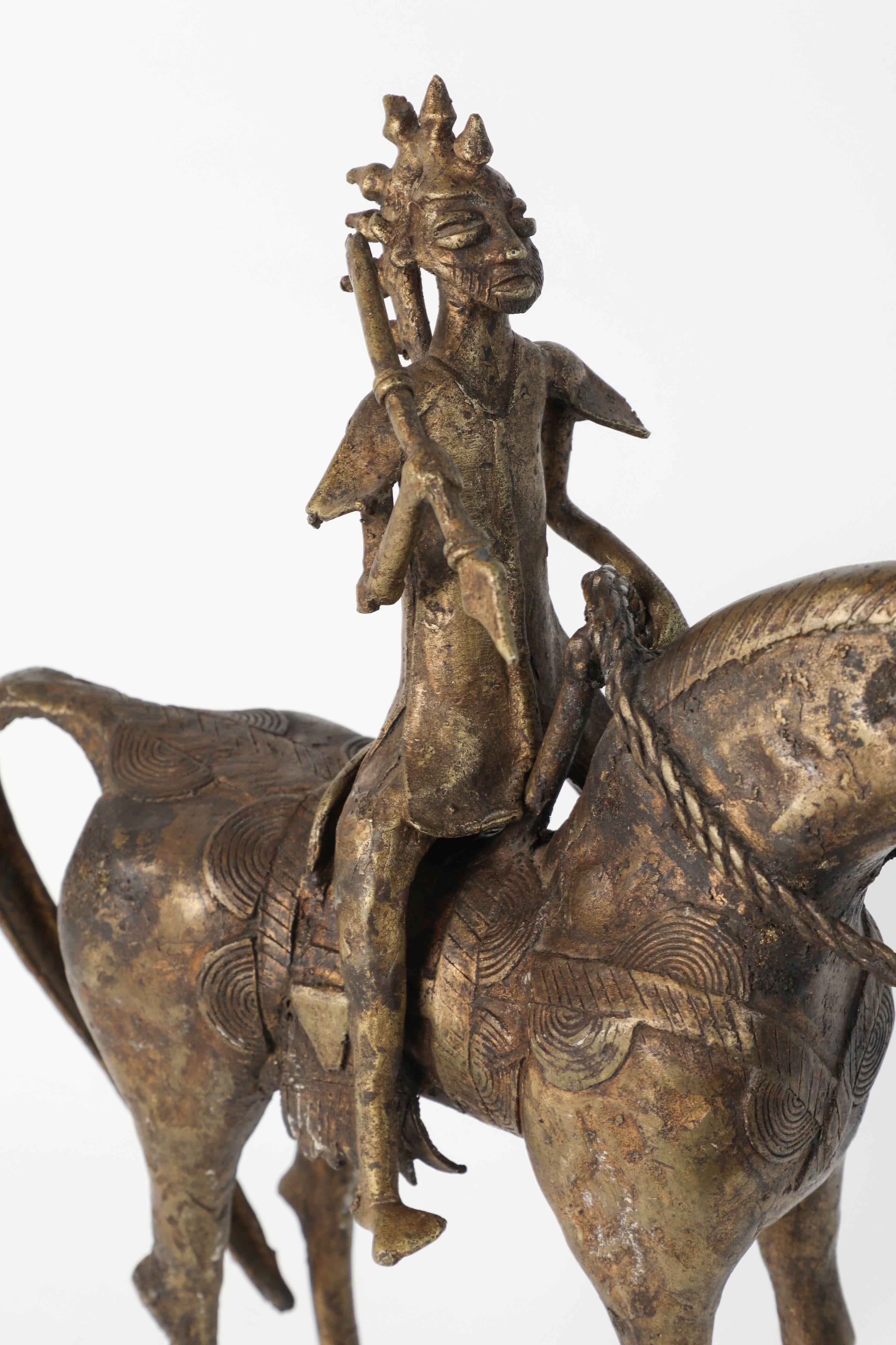 Wonderful decorative and heavy cast brass of an African horse rider.
The horse and warrior are in the style of the Dogon tribe with very modern tribal elongated form.
Measures: Height 17” 5 inches x width 15 inches x depth 4.5 inches.
The tribal