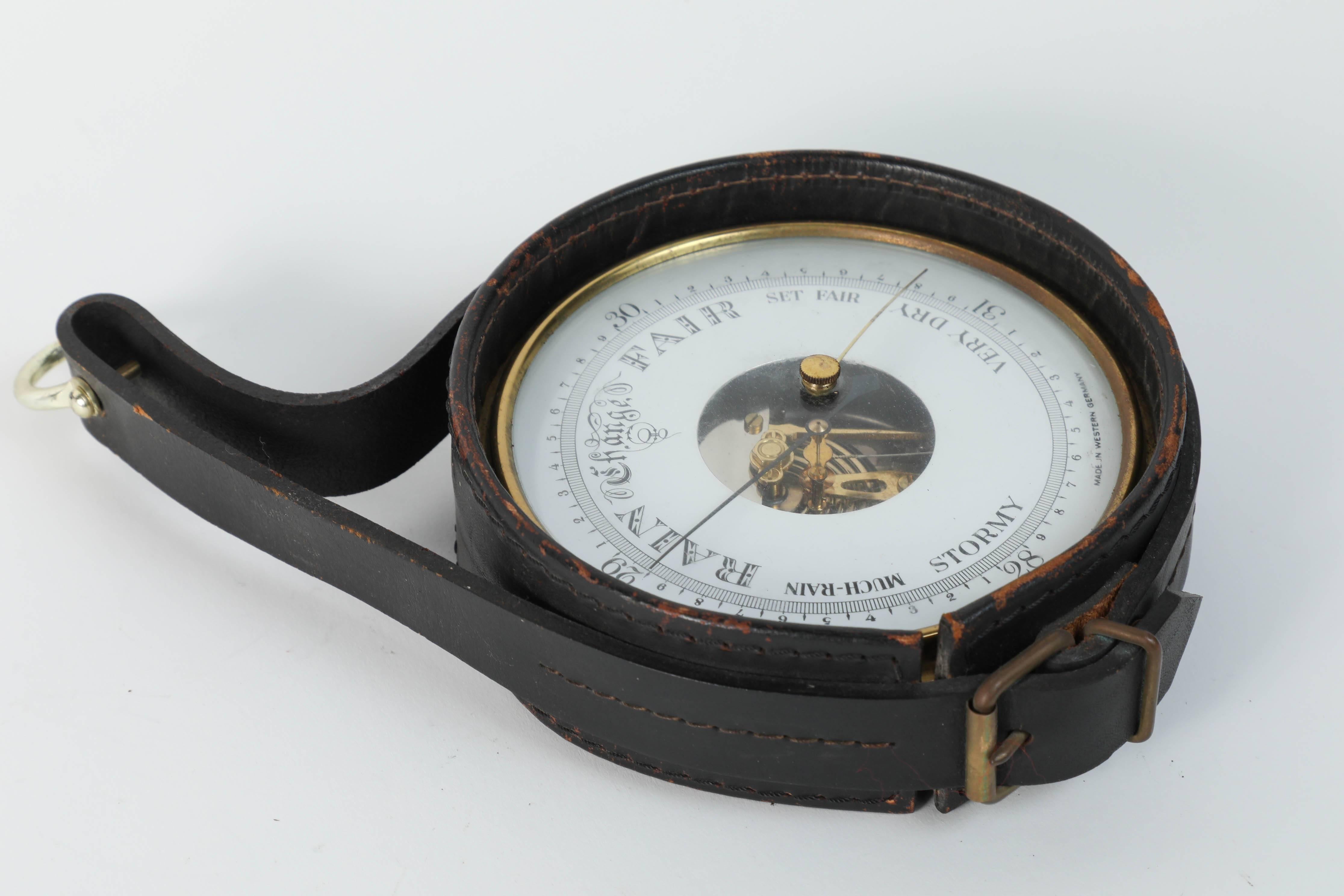 Vintage leather and brass hanging German Barometer.
Polished brass German barometer with readings in English.
Wrapped in a leather black strap with hanging bracket.
Great patina on leather in Jacques Adnet style.
Made in western Germany, marked