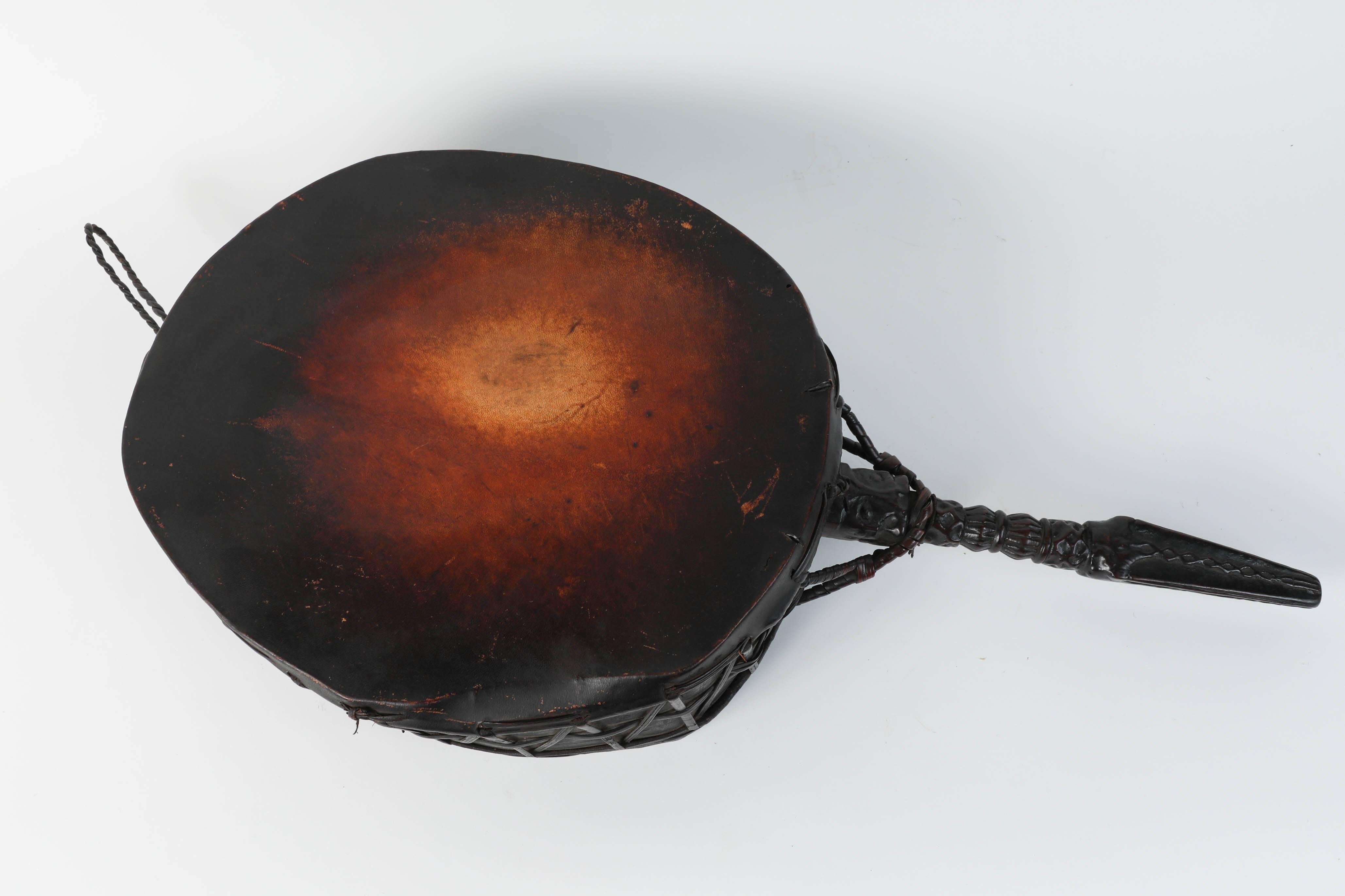 This is a Beautiful example of a traditional Tibetan Dhangro Dhani drum used by the Dhamis, or Shaman Medicine Man, of the Himalayas.
Buddhist Shaman Healing Instrument with Phurba form hawk's head and human faces handle, beads trapped