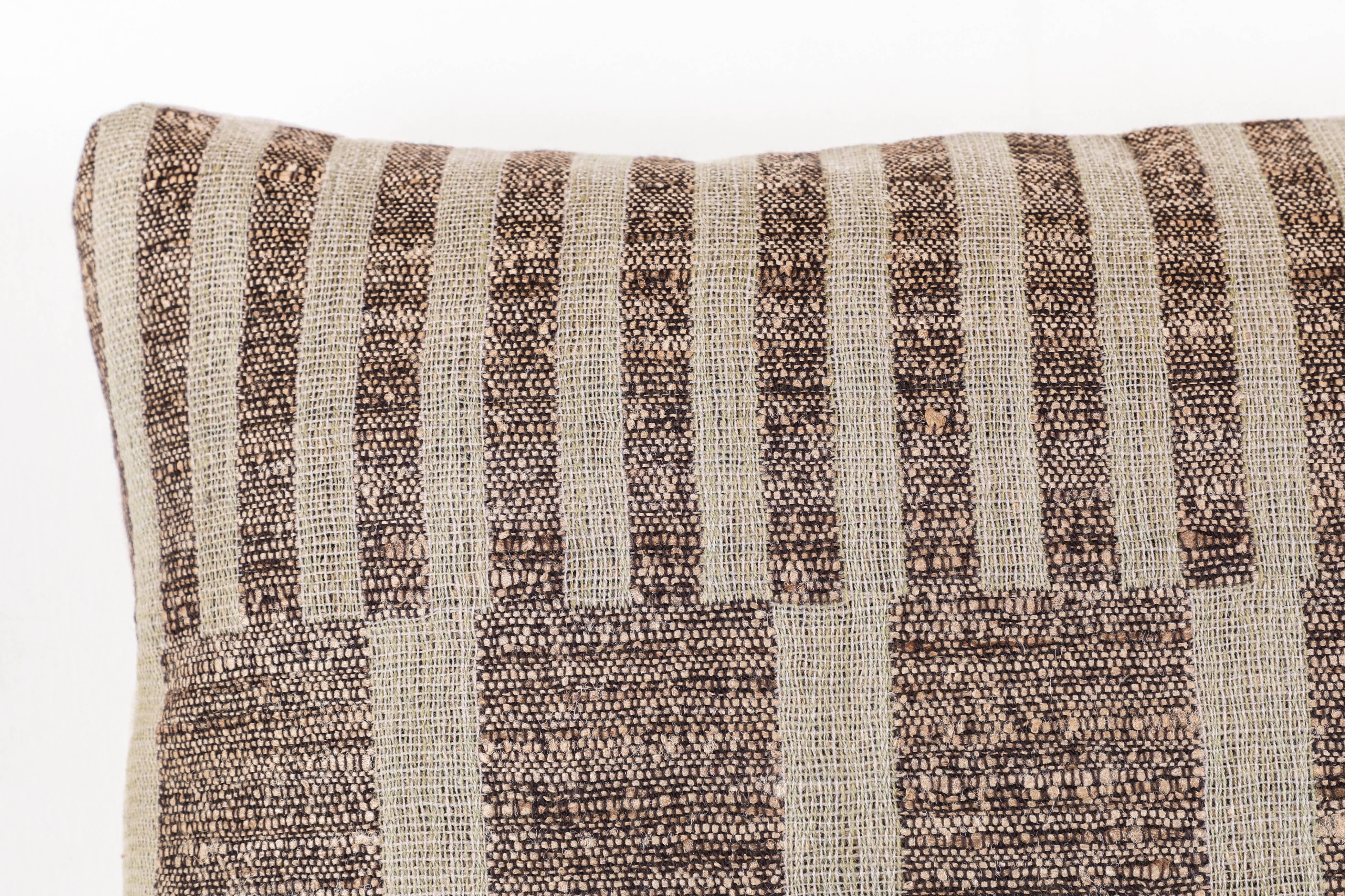 A contemporary line of cushions, pillows, throws, bedcovers, bedspreads and yardage hand woven in India on antique Jacquard looms. Hand spun wool; cotton, linen, and raw silk give the textiles an appealing uneven quality. Sizes vary slightly.

This