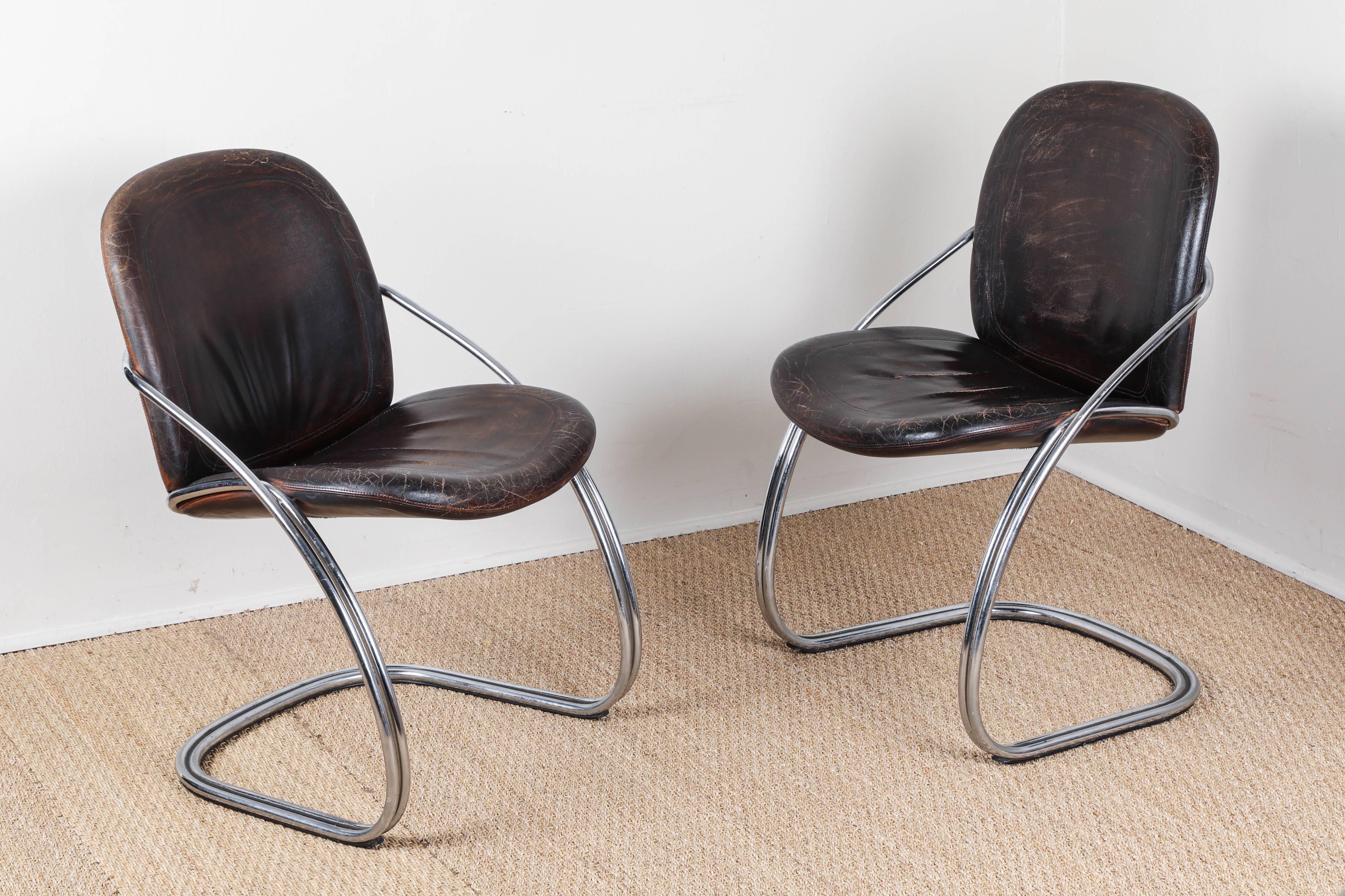 Ergonomic chrome chairs. Distressed dark brown leather seats and backs.  One chair SOLD
 