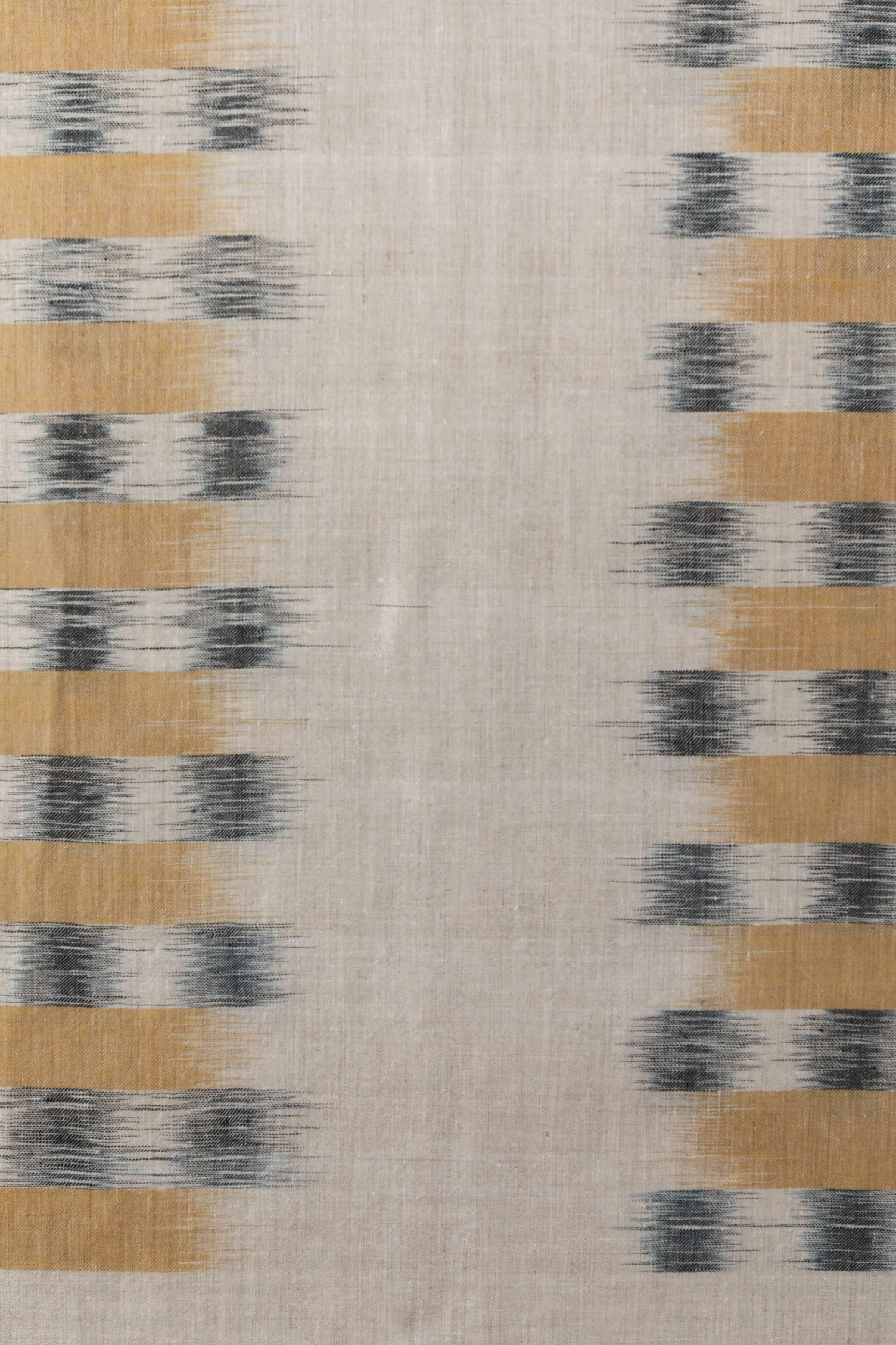 Pat McGann Workshop
Contemporary extra fine Ikat weave throw handwoven in Kashmir, India.