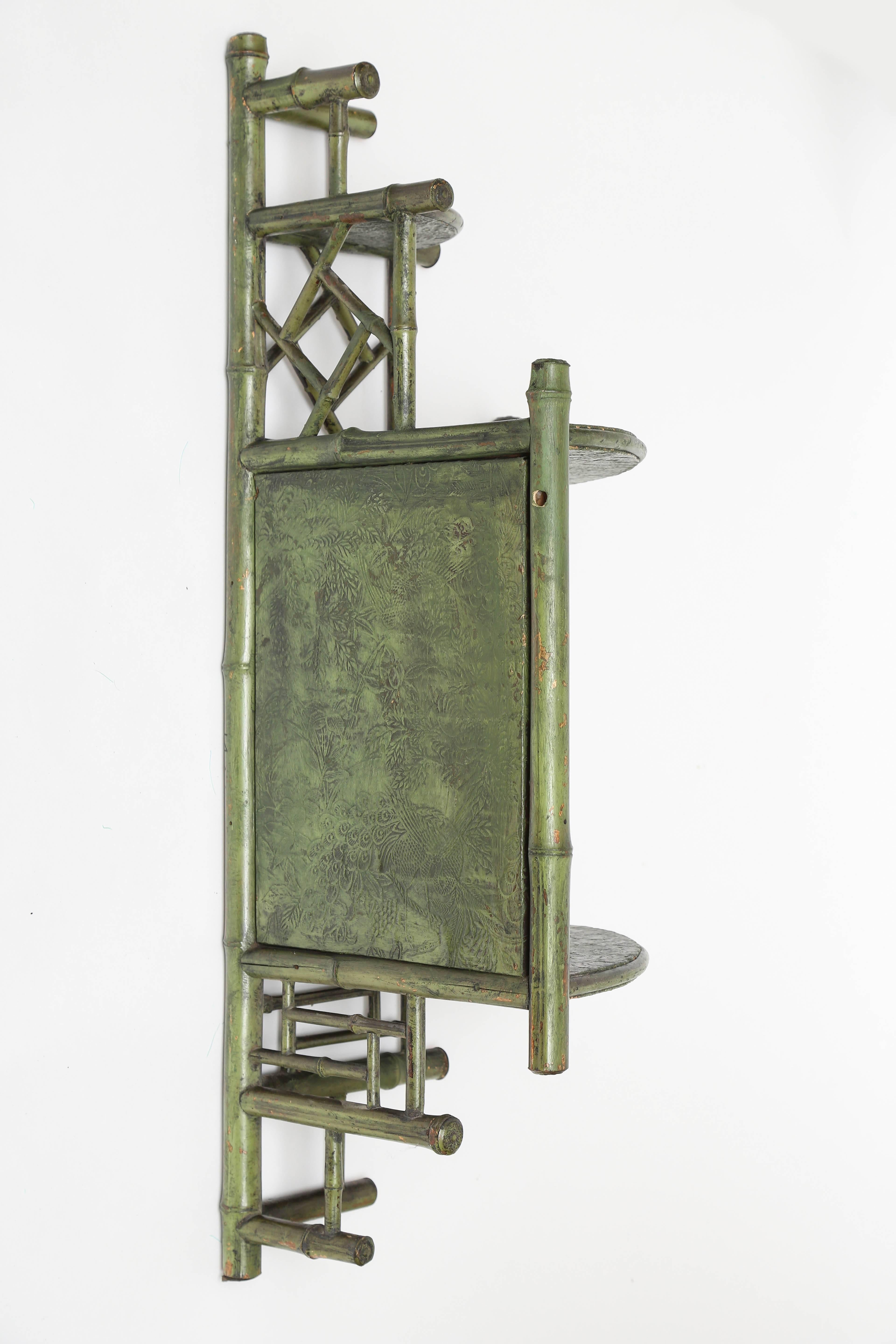 Antique corner hanging bamboo mirrored what not with beautiful green painted finish.