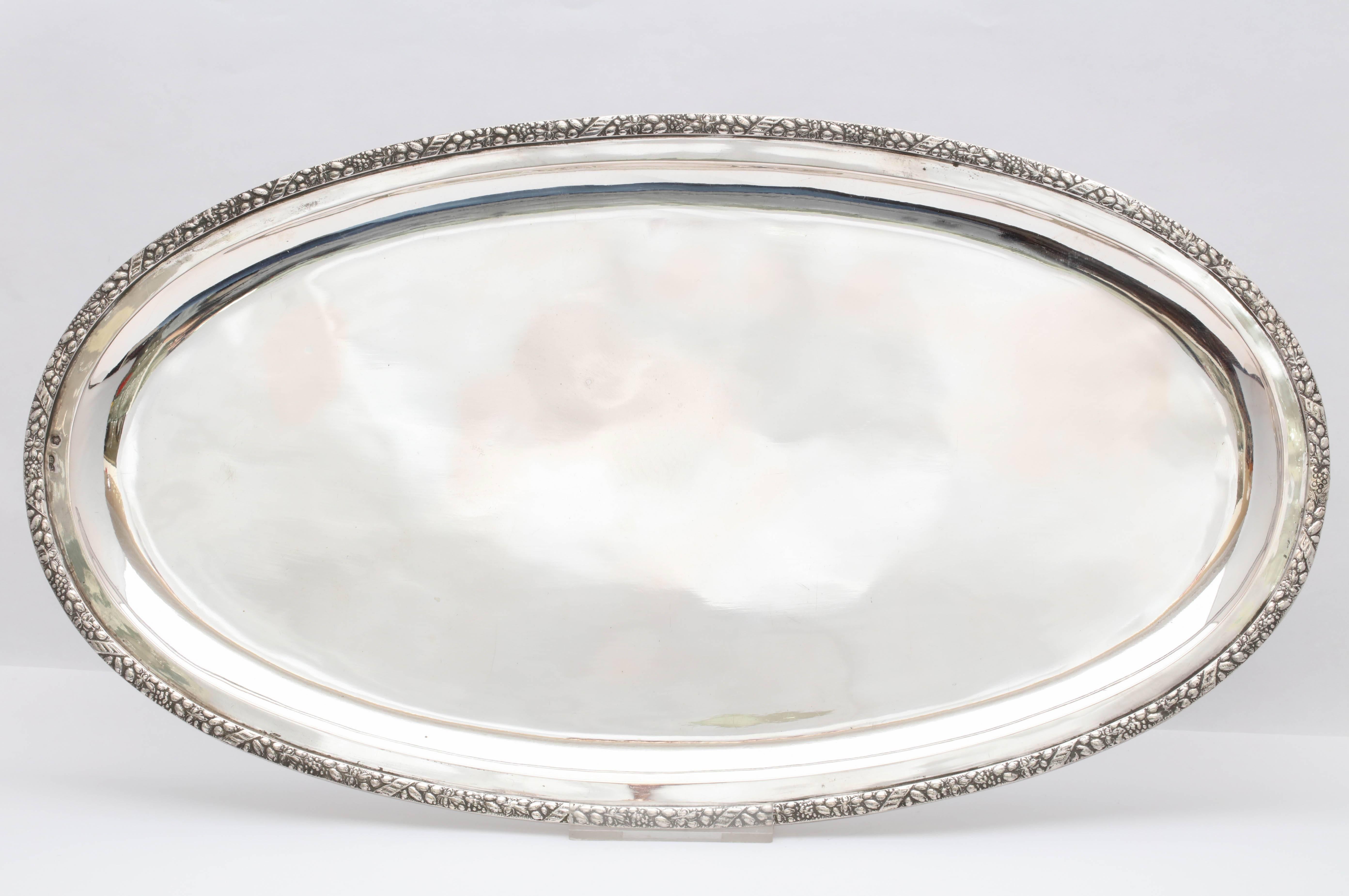 Victorian style, continental silver ‘.835’ oval serving or table platter, Austria, circa 1910. Measures: 14 1/2 inches long x 8 1/8 inches deep x 1/2 inch high. Weighs 16.895 Troy ounces. Can also be used on a dressing table. Dark spots in photos