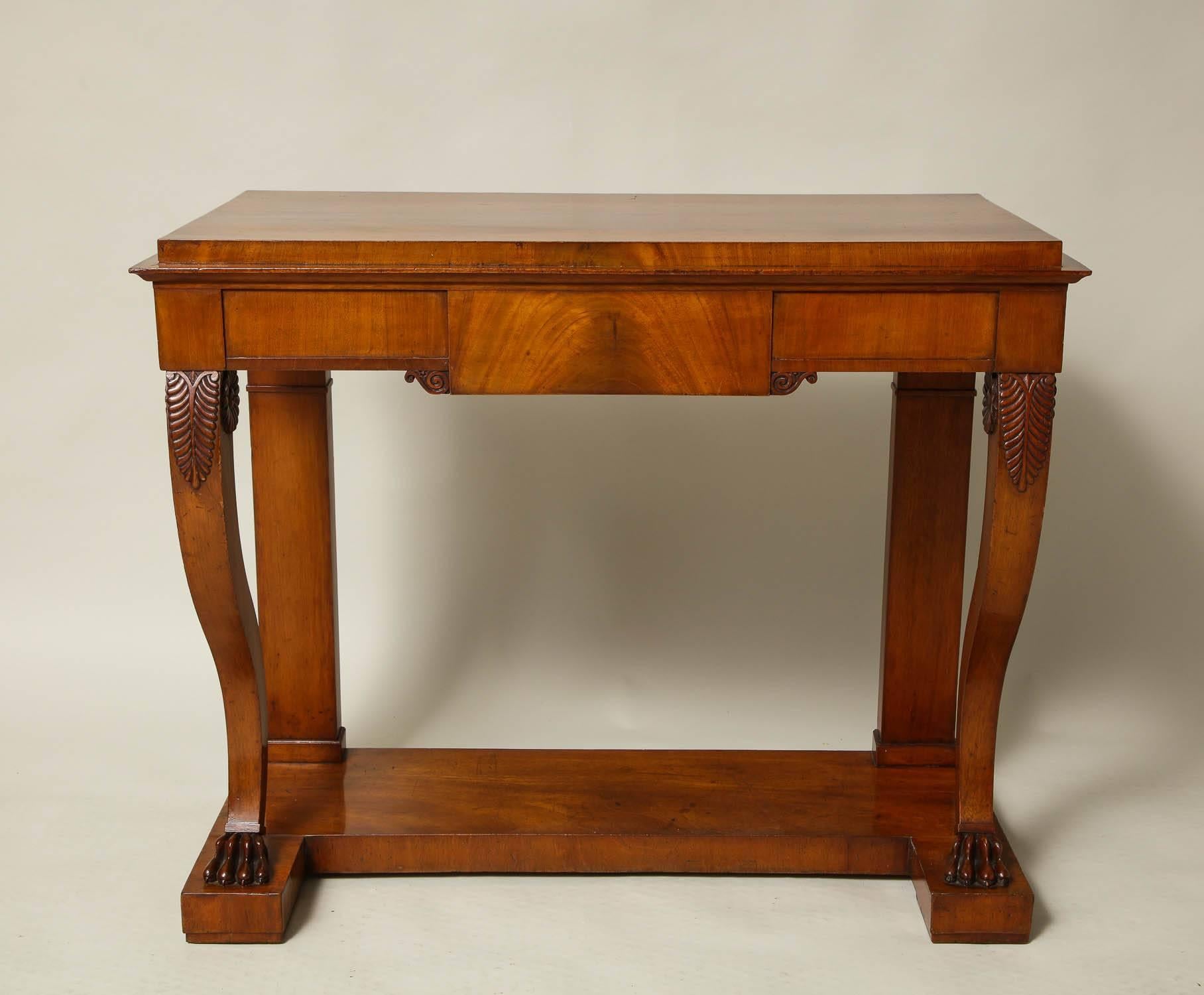 Very fine pair of Swedish early 19th century mahogany neoclassical pier tables by AJ Soderholm, Abo Sweden (each labeled to the underside) having square edged tops and very architectural aprons standing on patera decorated scrolled legs ending in
