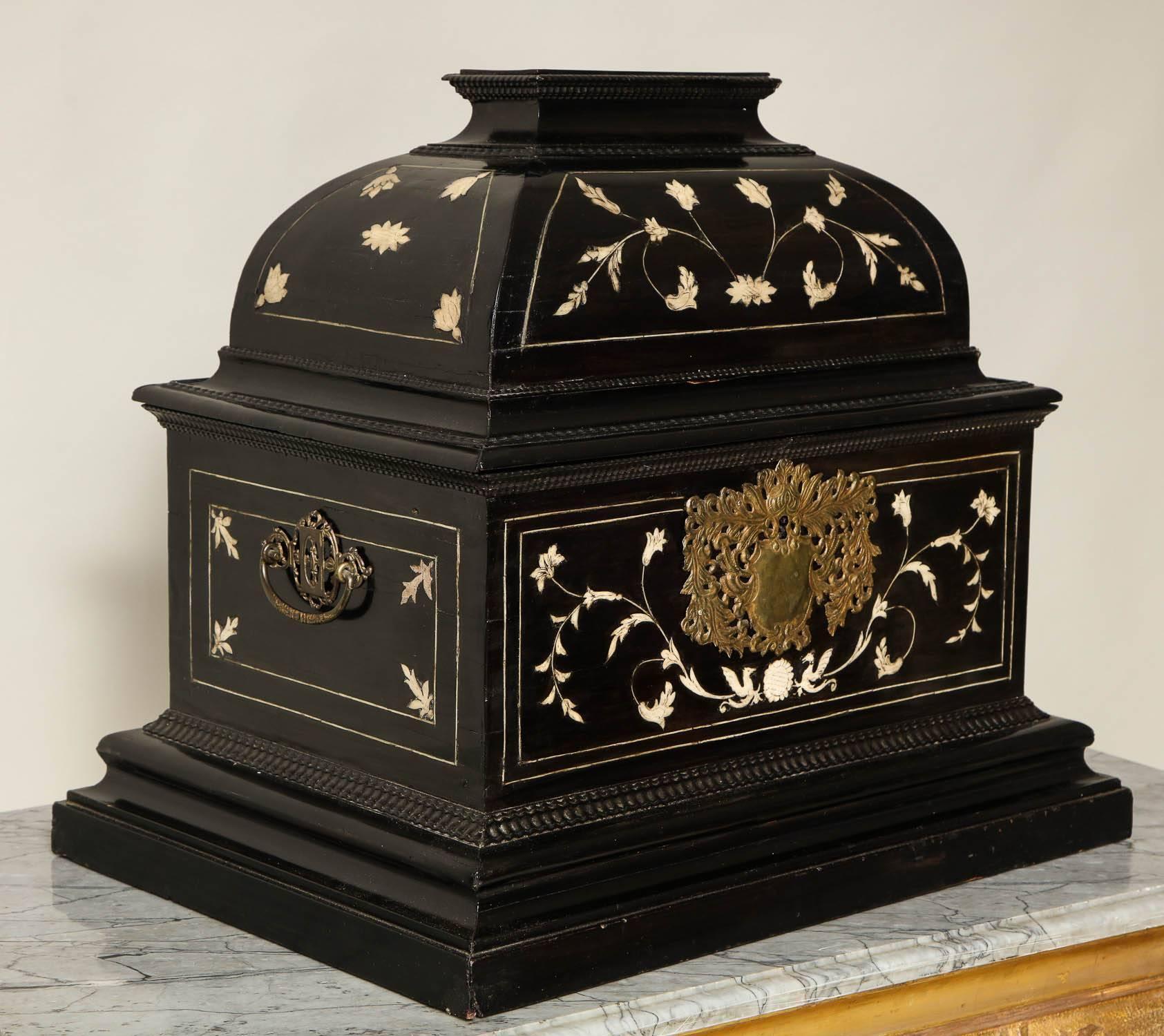 Very fine Baroque period Flemish bone inlaid ebony valuables chest, the domed lid with floral inlay and ripple molding, over gilt brass pierced escutcheon and handles, the front and sides also with floral bone inlay over stepped molded base, the