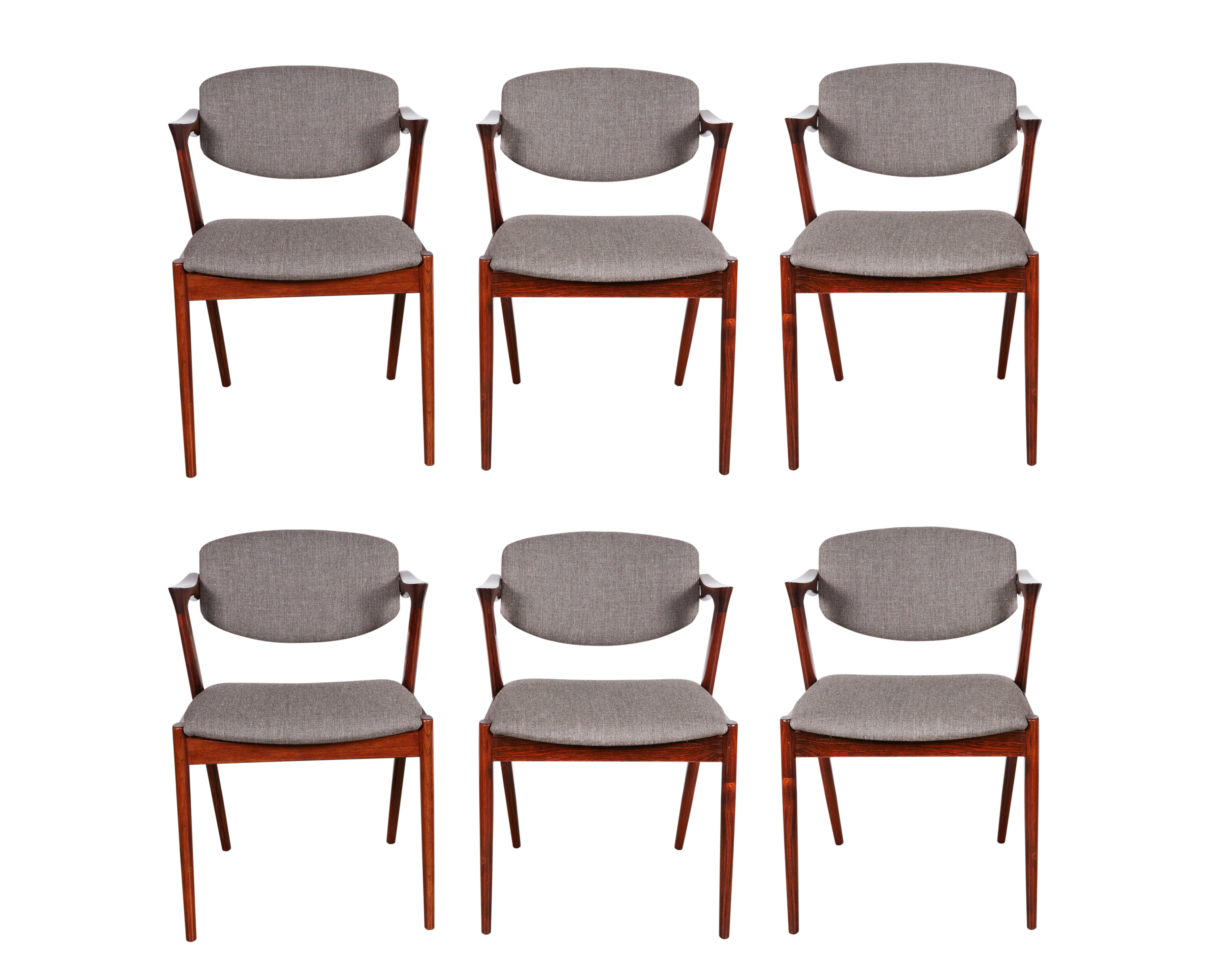 Vintage 1950s Rosewood Danish Dining Chairs by Kai Kristiansen

These vintage side chairs are in like-new condition. The swivel back that adjust to your back makes it like a little lounge chair at the dining table. The most comfortable dining chair
